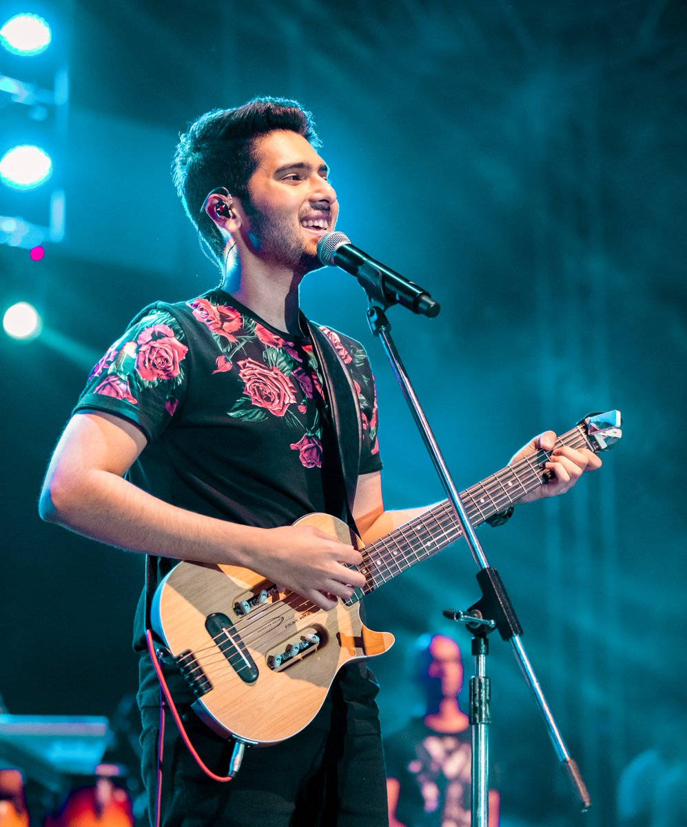 Armaan Malik, light wood guitar, blue-lit stage, SD Phone Wallpaper