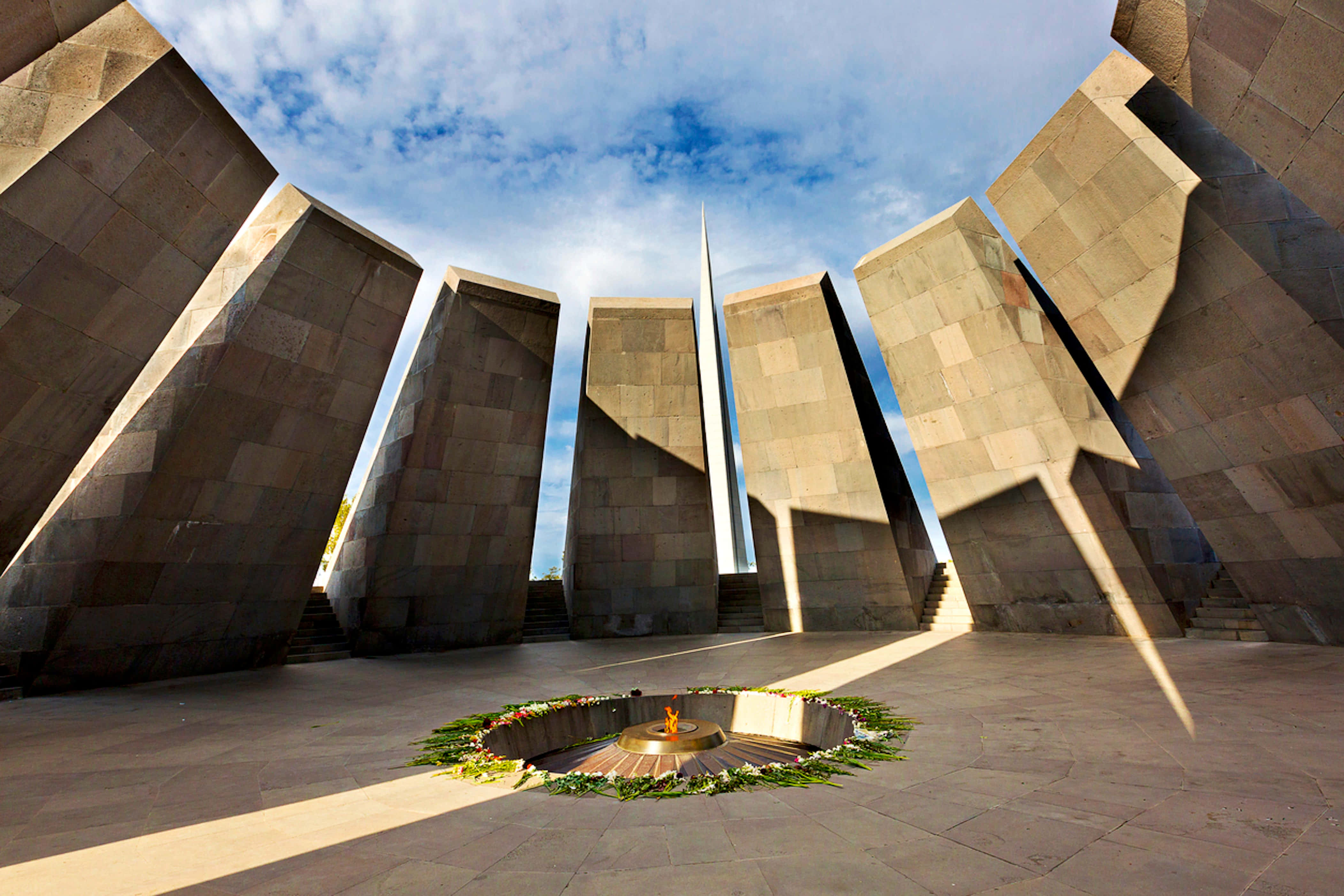 Armenian Genocide Memorial, towering stone slabs, central eternal flame, 4K Desktop Wallpaper