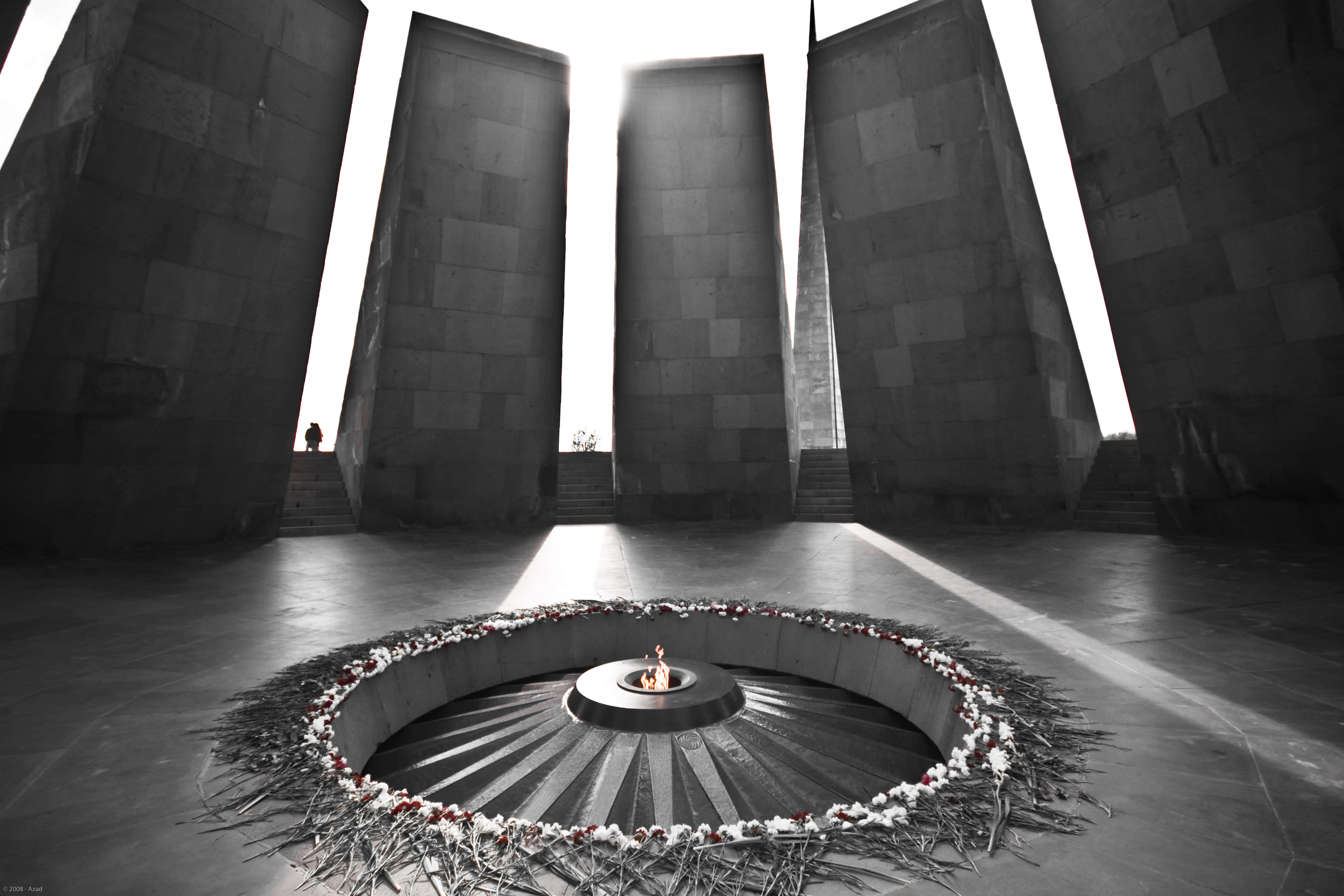 Armenian Genocide Memorial, towering stone pillars, central eternal flame, 4K Desktop Wallpaper