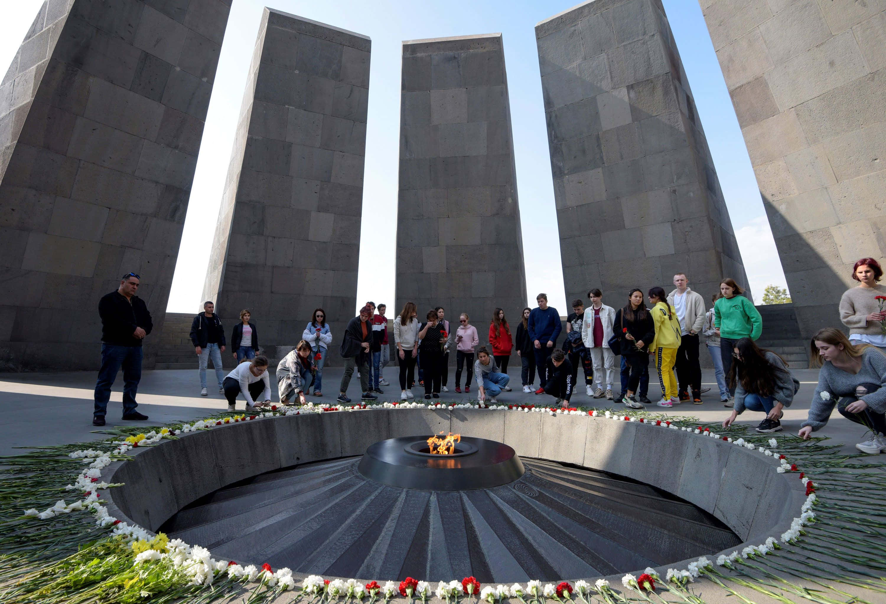 Armenian Genocide Memorial, eternal flame, gray stone pillars, 2K Desktop Wallpaper