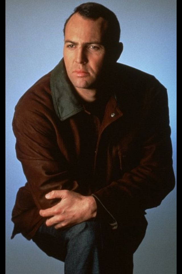 Arnold Vosloo, brown jacket, solid blue background, SD Phone Wallpaper