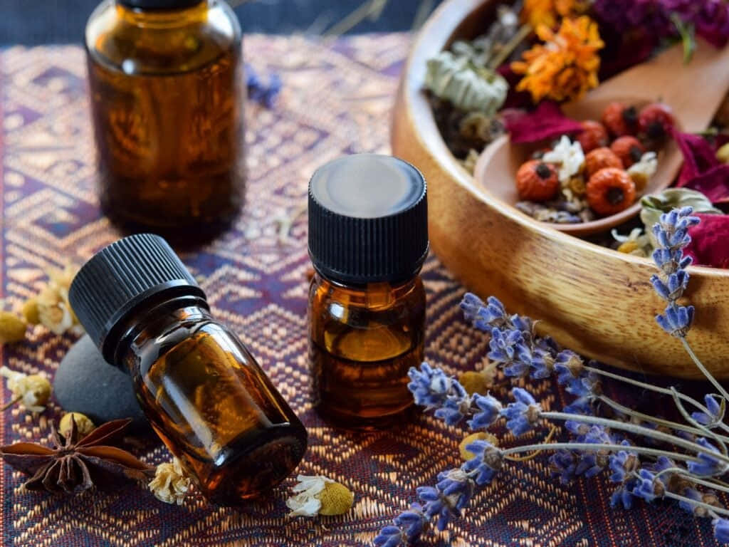 Aromatherapy, amber glass essential oil bottles, patterned cloth, SD Desktop Wallpaper