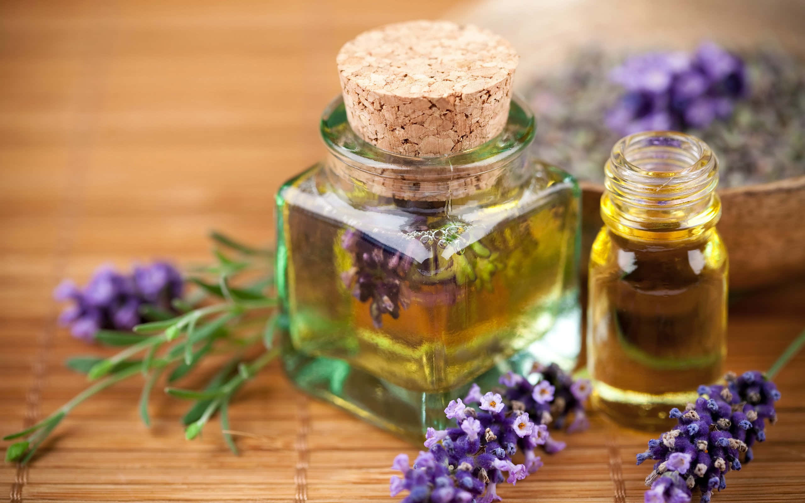 Aromatherapy, golden lavender oil, purple lavender sprigs, 2K Desktop Wallpaper