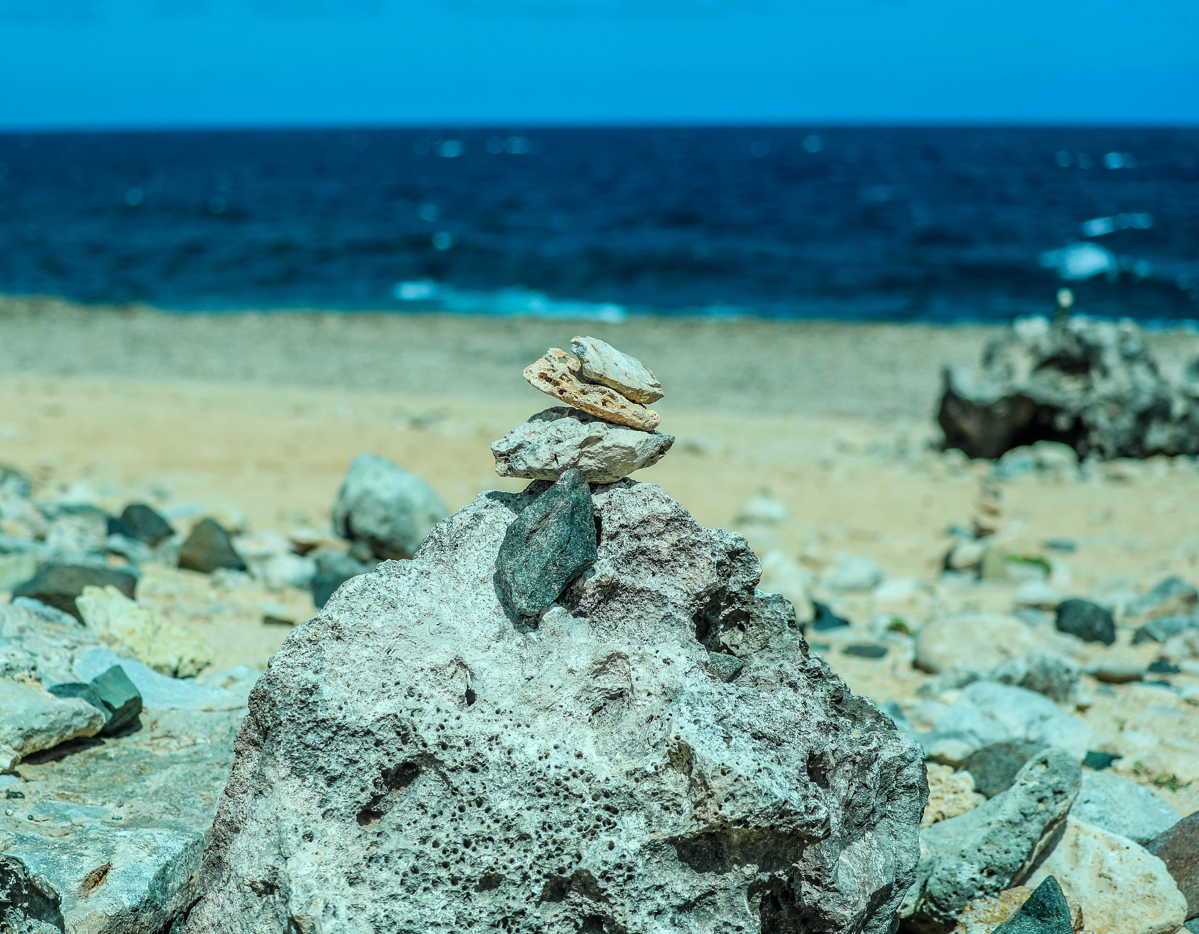 Aruba, rock cairns, sunlit beach, 4K Desktop Wallpaper