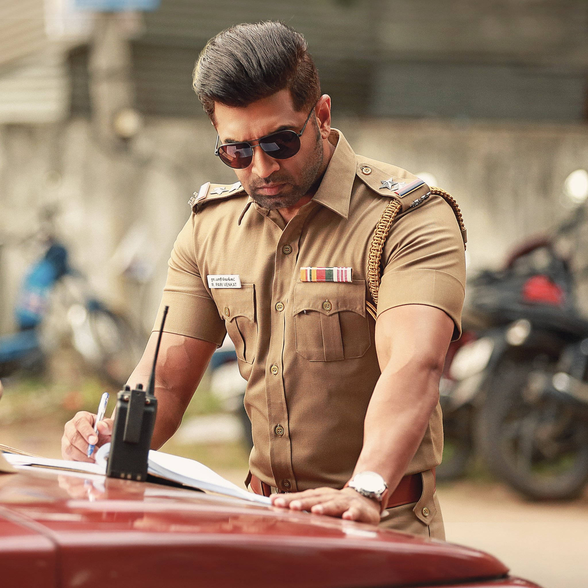 Arun Vijay, khaki uniform, red car hood, Full HD Phone Wallpaper