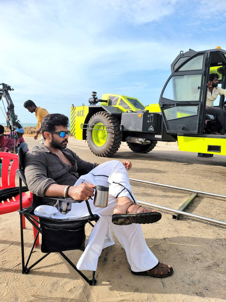 Arun Vijay, sandy beach, bright yellow crane, SD Phone Wallpaper