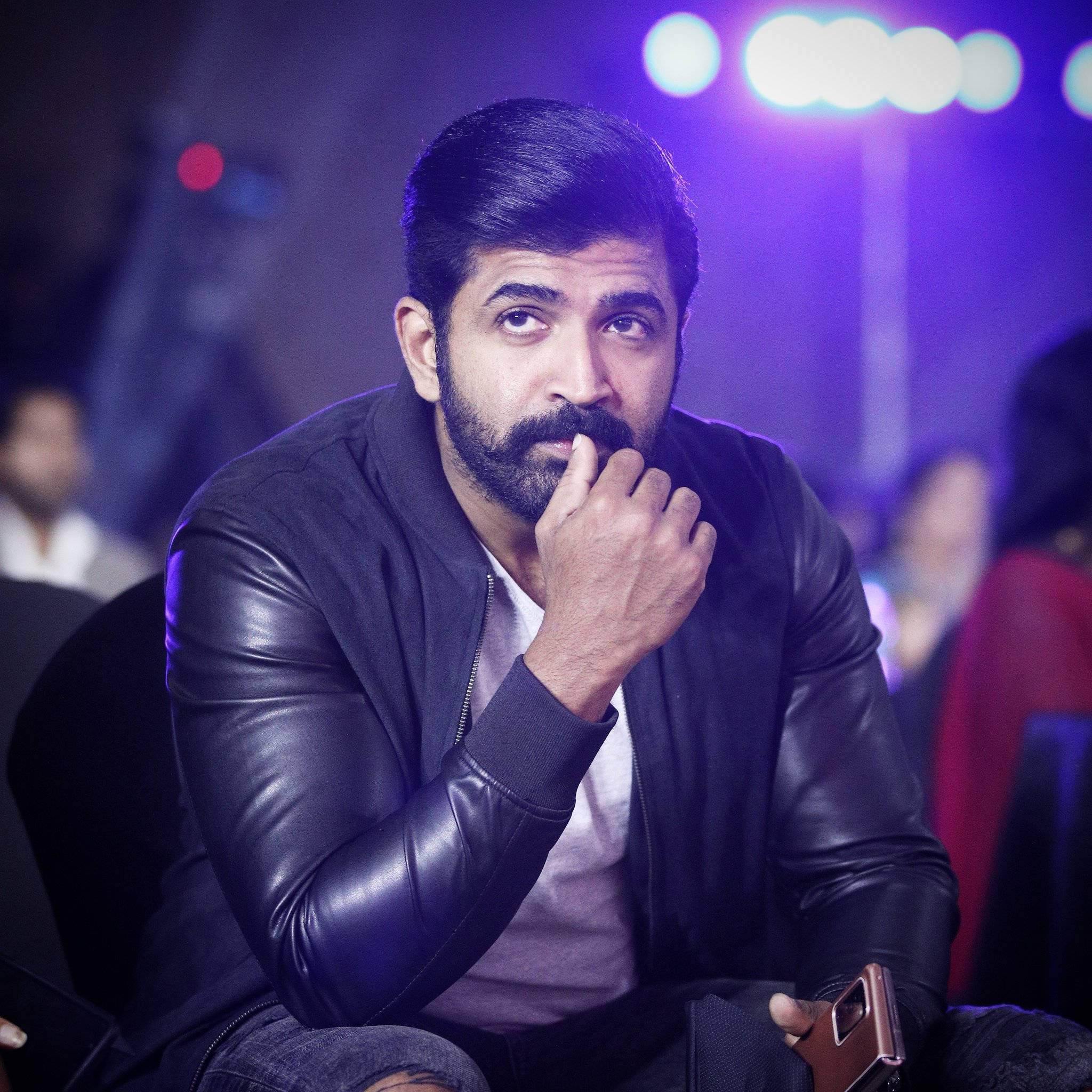 Arun Vijay, black leather jacket, dimly lit venue, Full HD Desktop Wallpaper