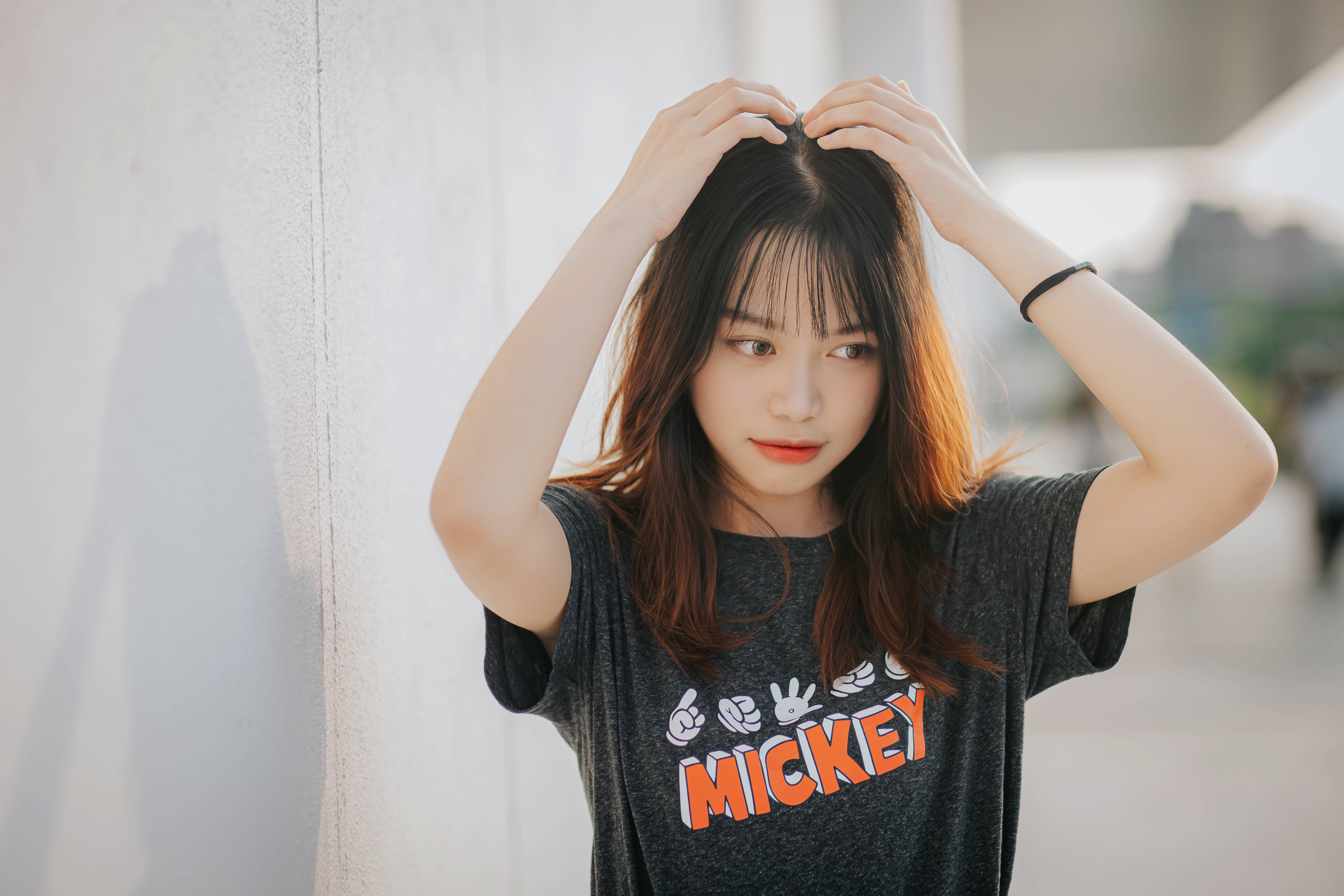 Mickey Mouse t-shirt, brown hair, bright white wall, 5K Desktop Wallpaper