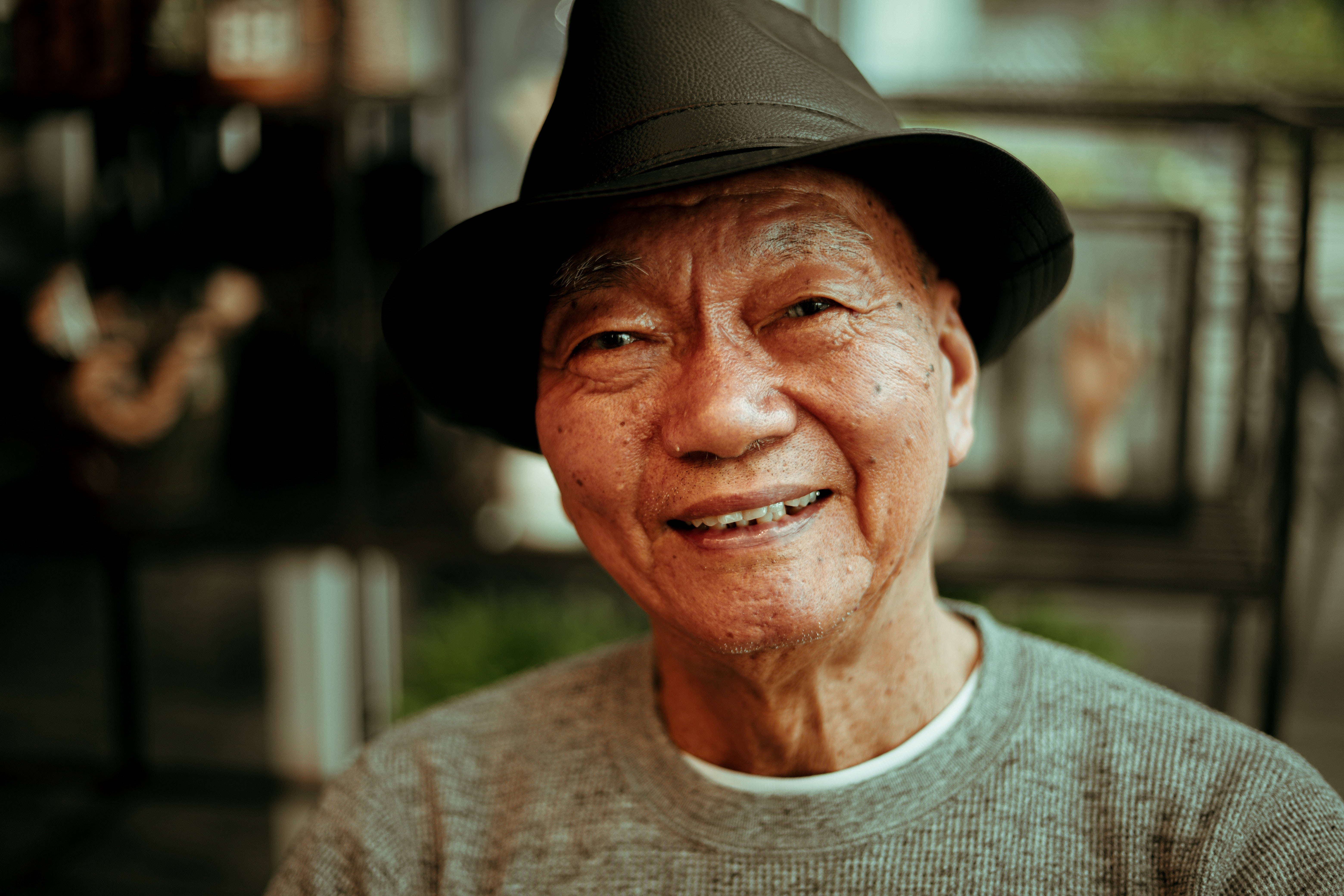old Asian man, black fedora, textured sweater, 5K Desktop Wallpaper