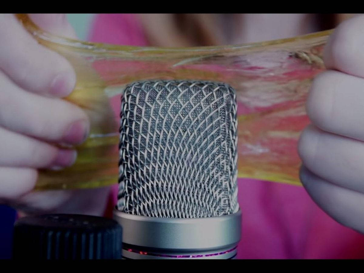 glowing yellow slime, silver microphone grille, close-up shot, SD Desktop Wallpaper