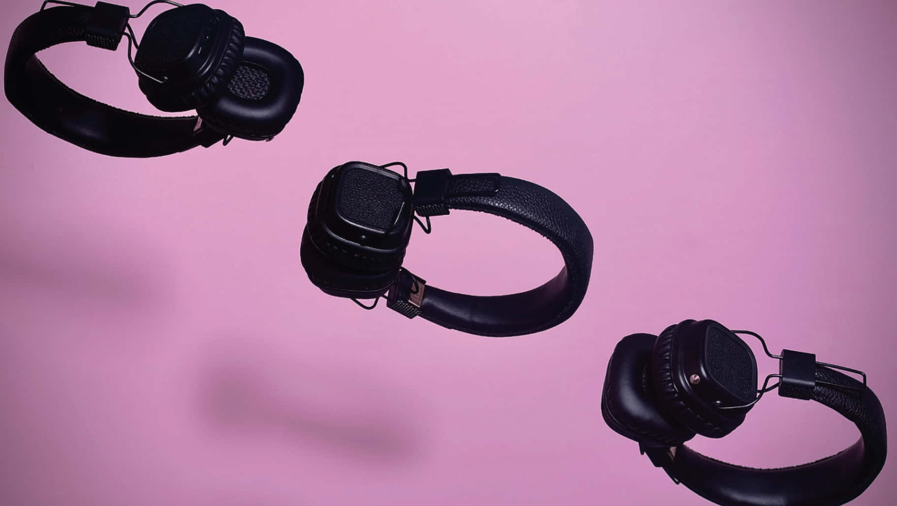 black, over-ear headphones, soft pink background, HD Desktop Wallpaper