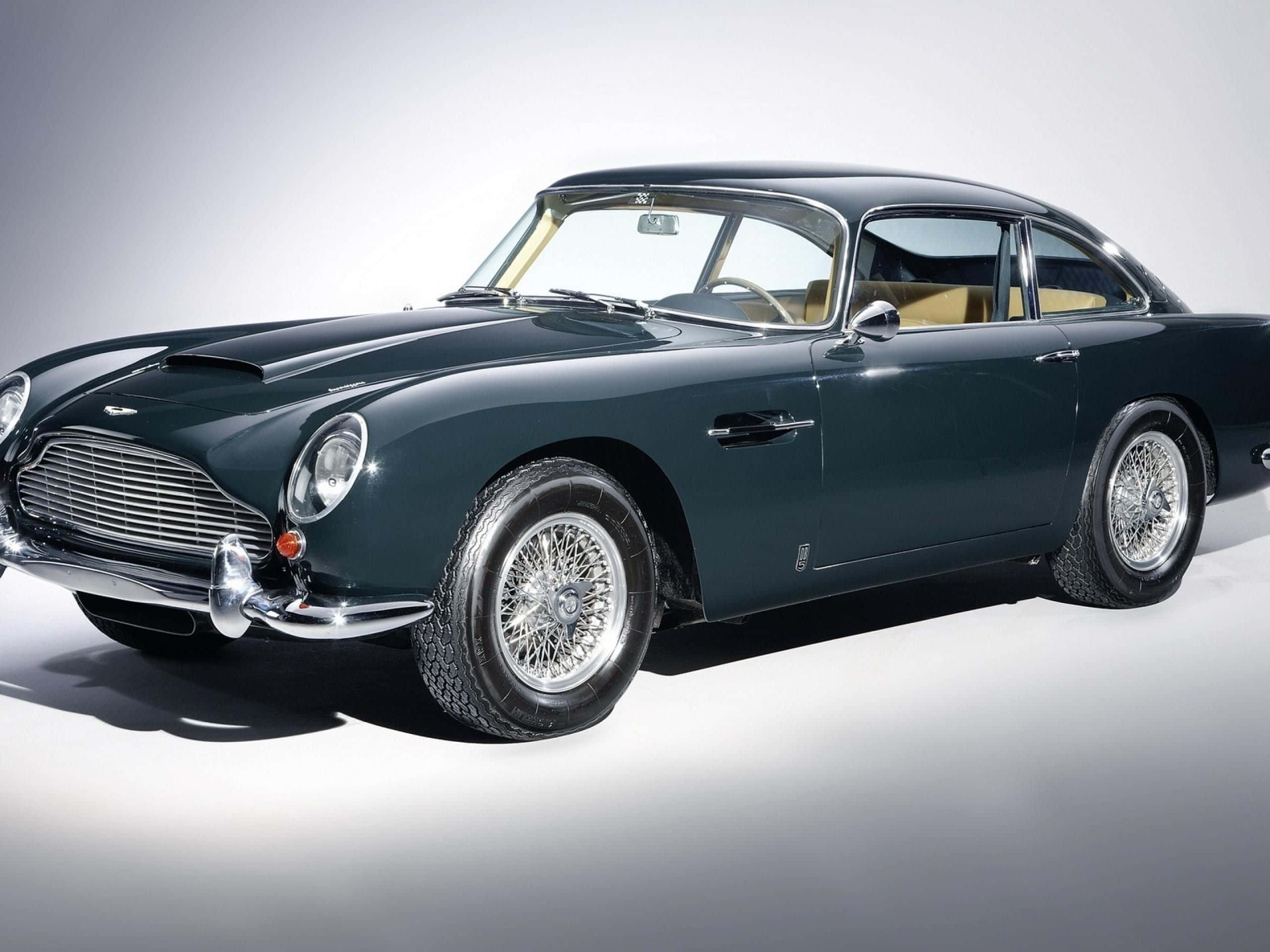 Aston Martin DB5, dark green, studio lights, 2K Desktop Wallpaper