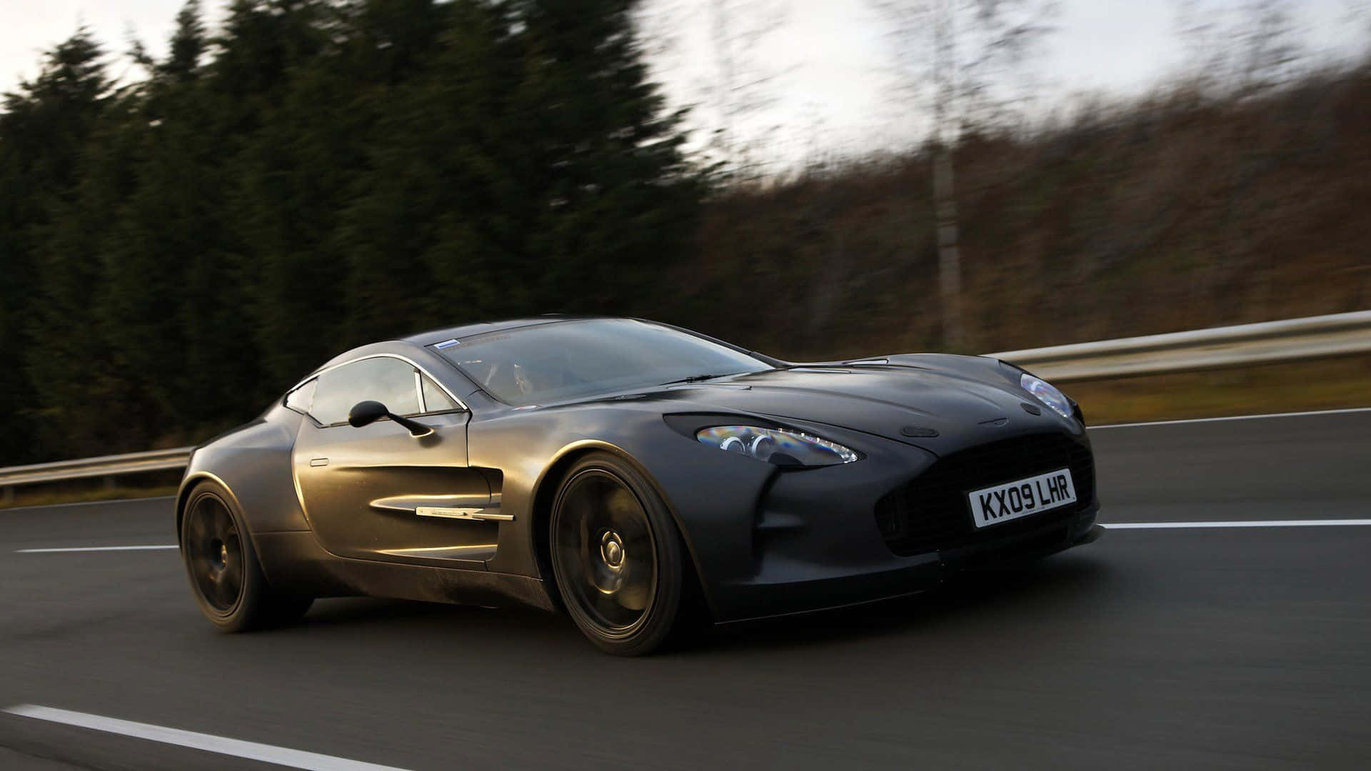 Aston Martin One-77, matte black, forest-lined road, Full HD Desktop Wallpaper