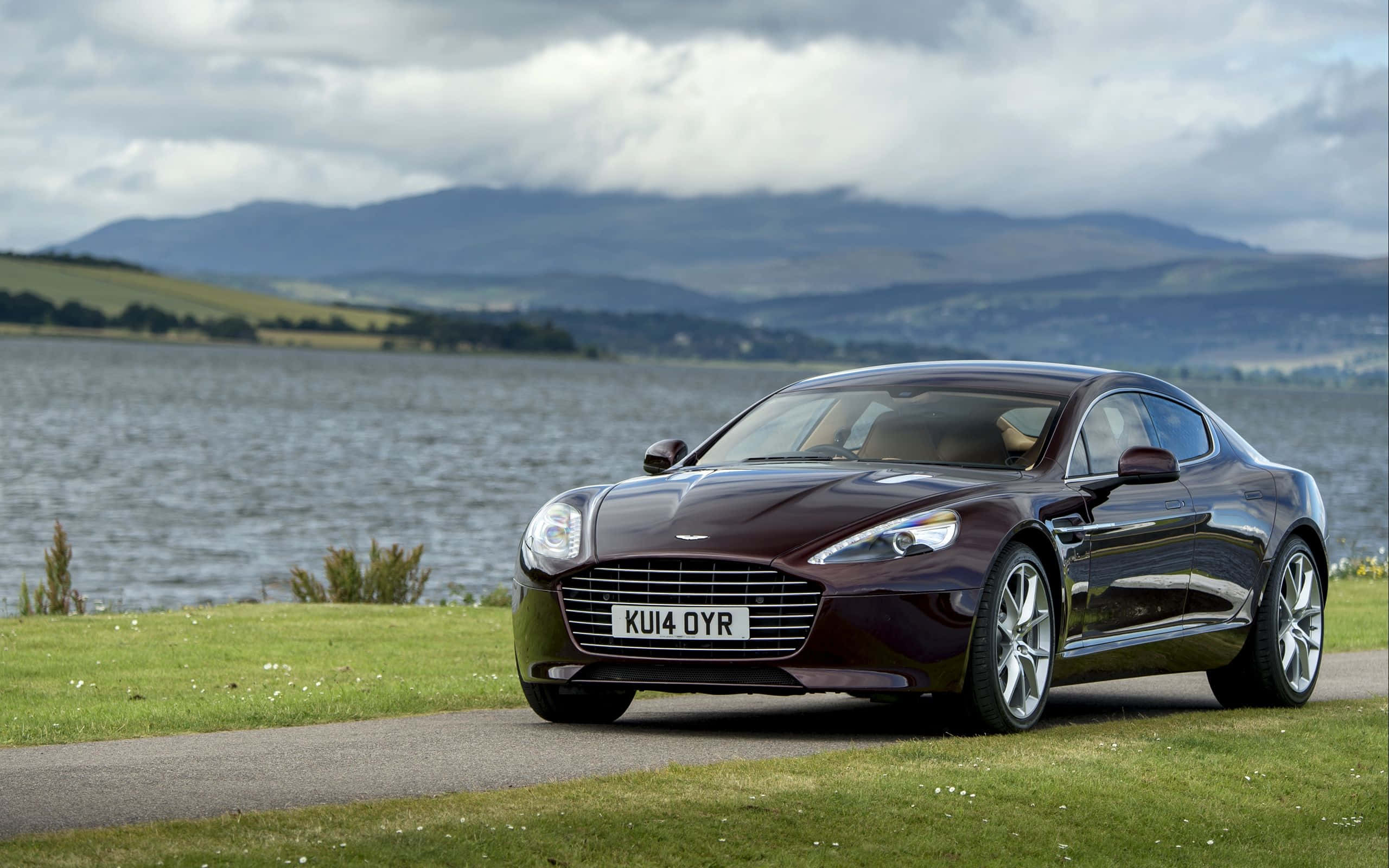 Aston Martin Rapide S, maroon, grassy lakeside path, 2K Desktop Wallpaper