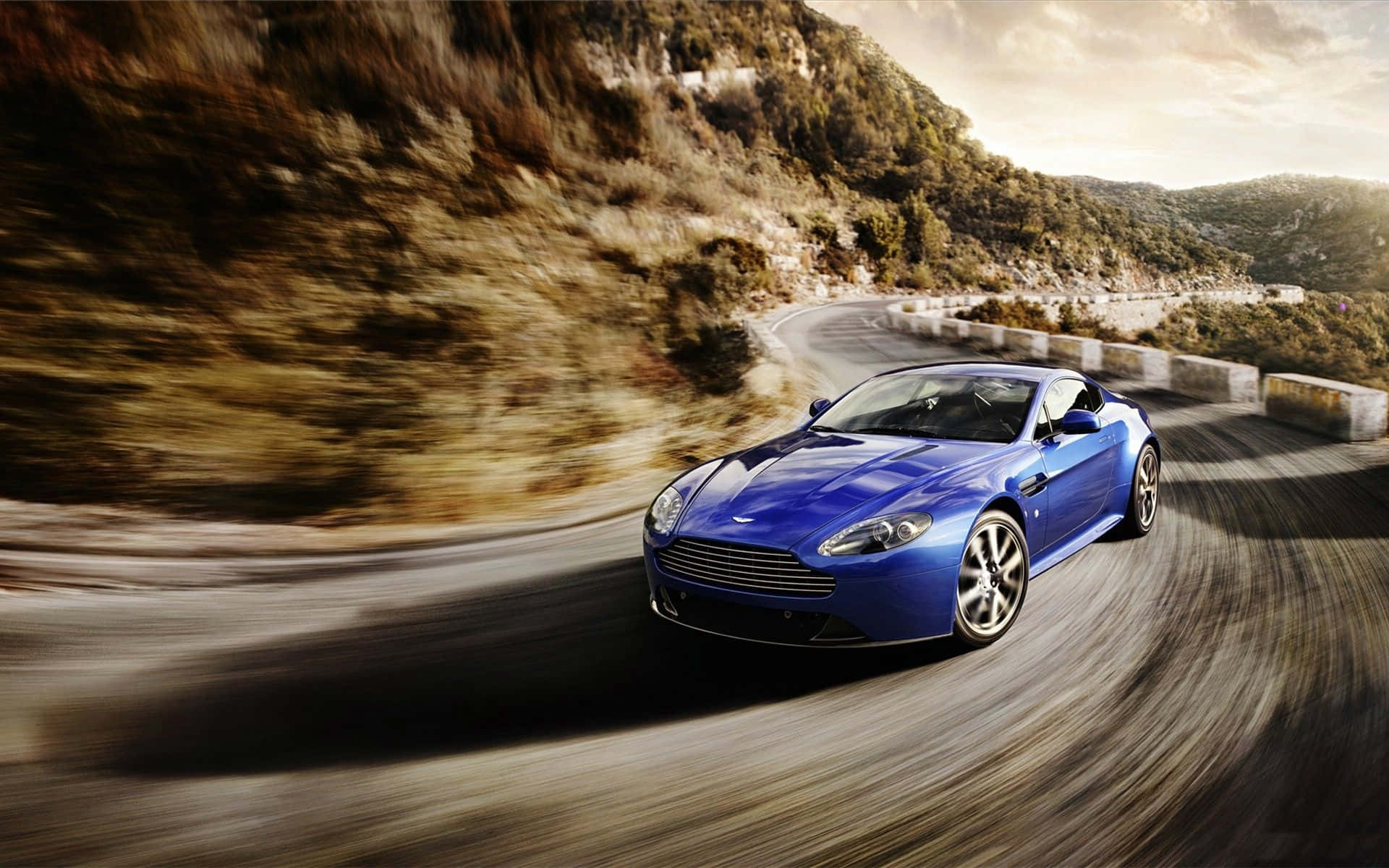 Aston Martin V12 Vantage, vibrant blue, winding mountain road, Full HD Desktop Wallpaper