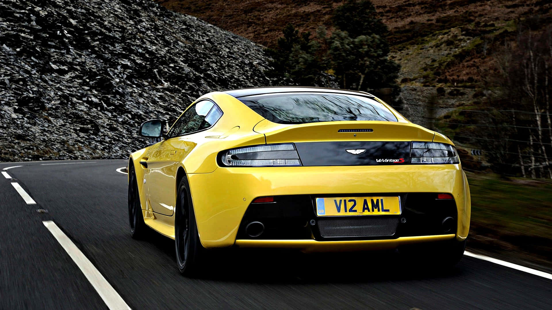 Aston Martin V12 Vantage, vibrant yellow, winding mountain road, Full HD Desktop Wallpaper