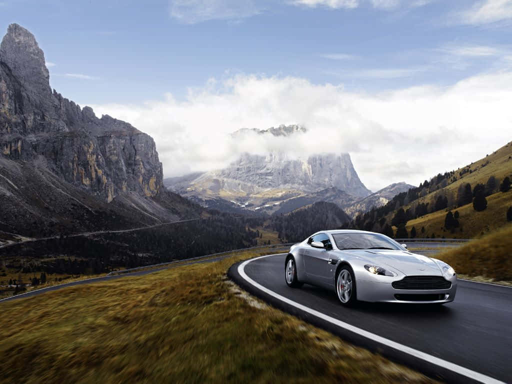 Aston Martin V12 Vantage, silver, winding mountain road, SD Desktop Wallpaper