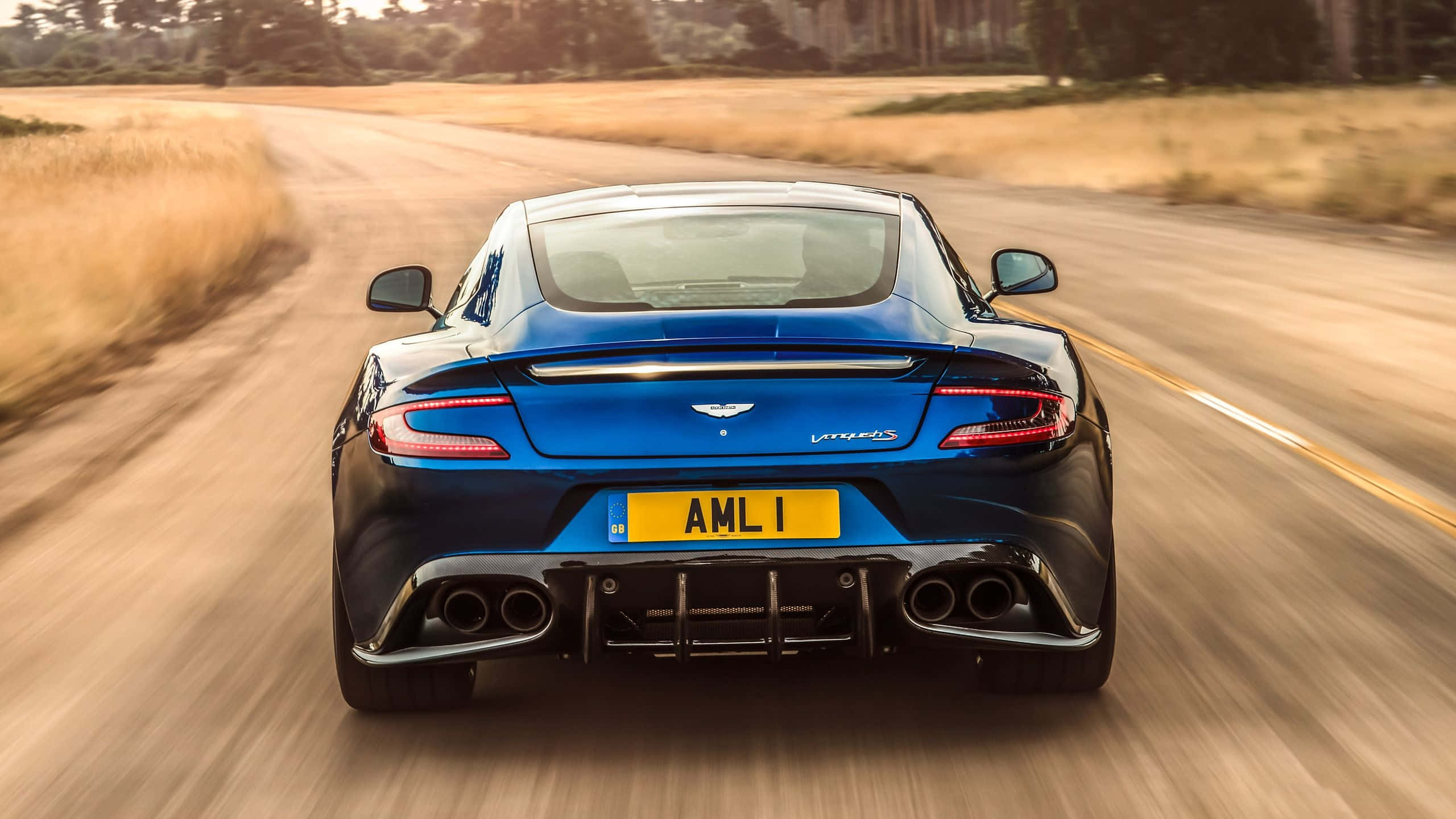 Aston Martin Vanquish, blue, sunlit rural road, 2K Desktop Wallpaper
