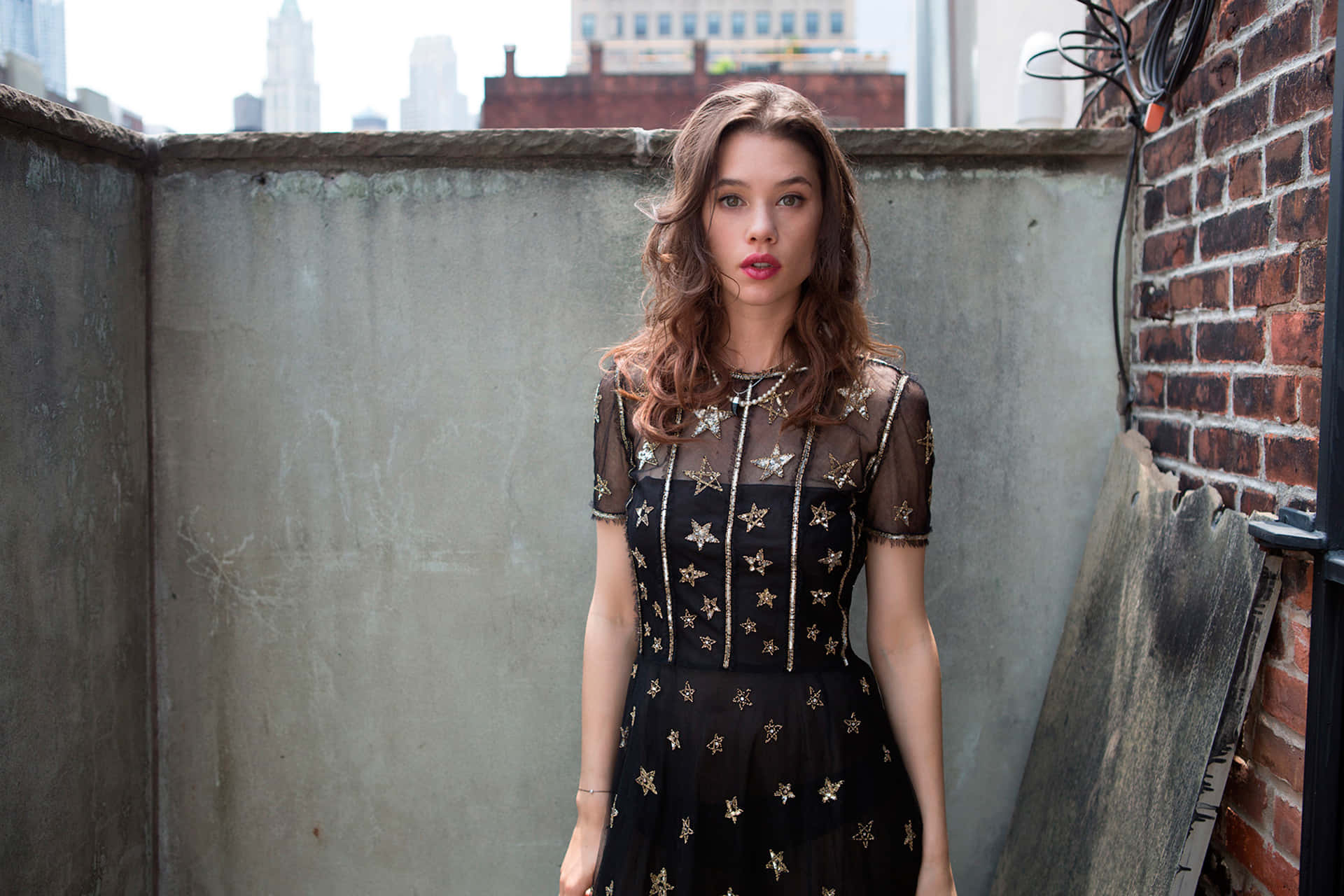 Astrid Berges Frisbey, black star-embellished dress, gritty urban rooftop, Full HD Desktop Wallpaper