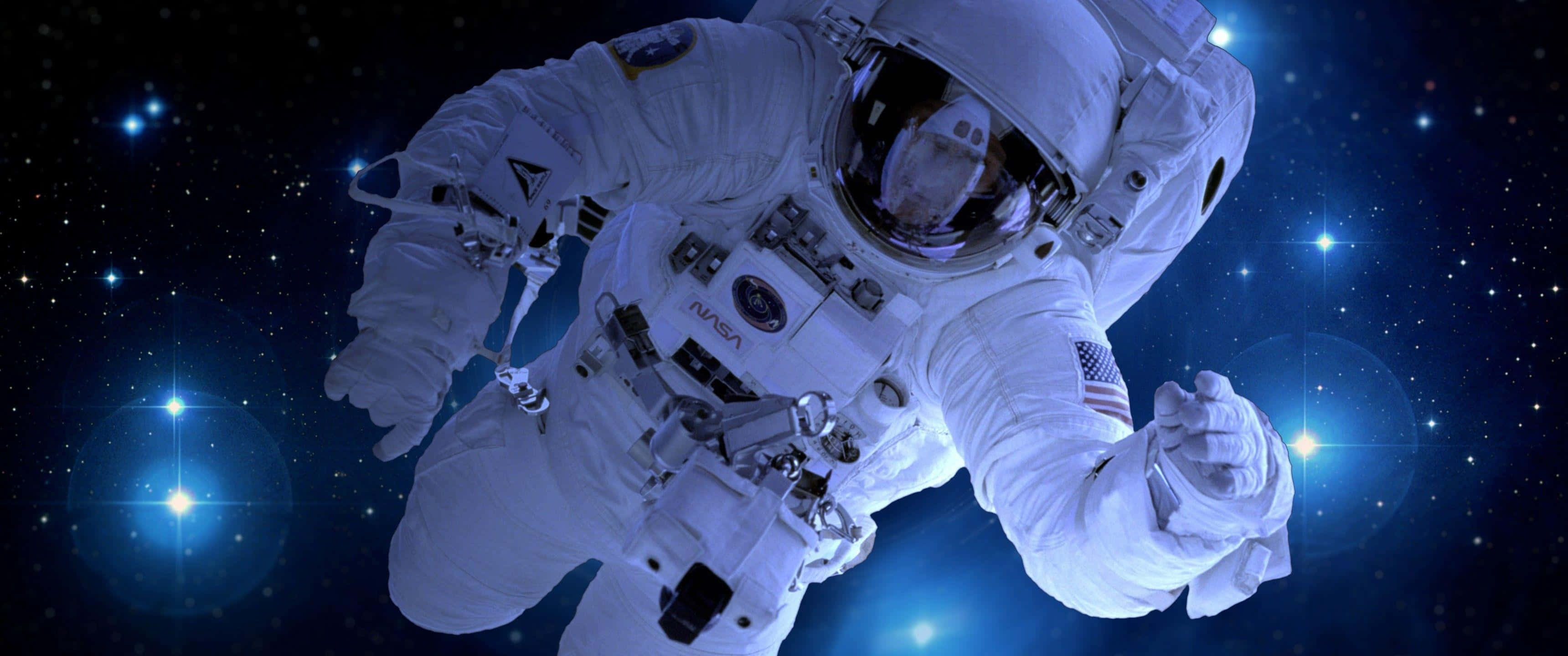Astronaut, white spacesuit, starry blue cosmic backdrop, 2K Desktop Wallpaper
