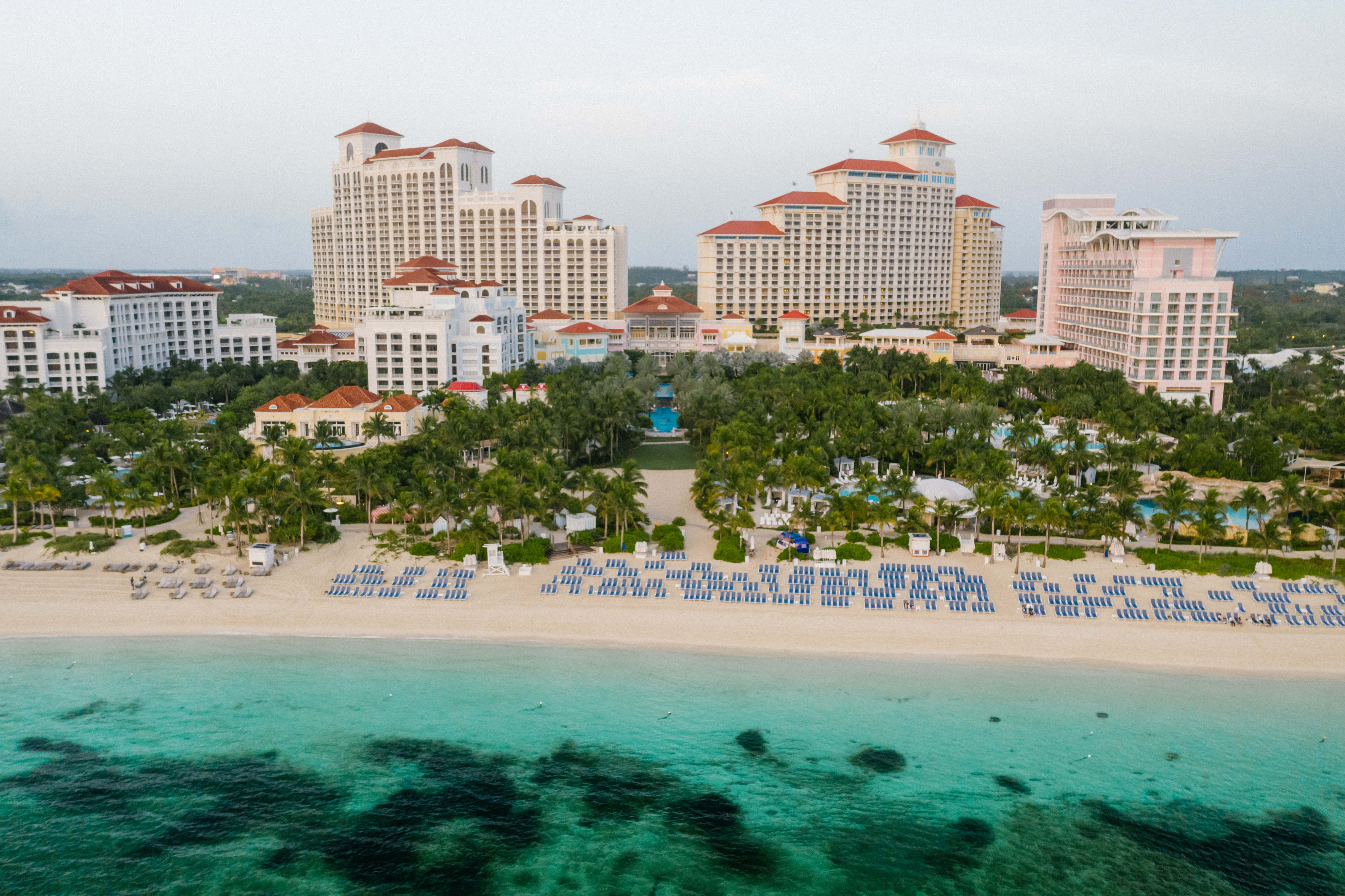 Atlantis Resort, turquoise waters, blue lounge chairs, 5K Desktop Wallpaper