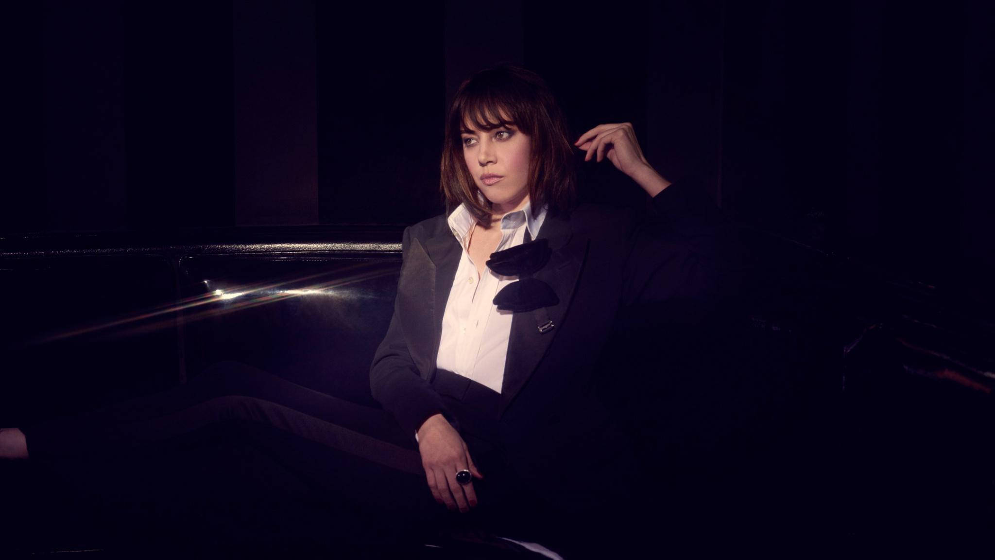 Aubrey Plaza, dark suit, dimly lit car, Full HD Desktop Wallpaper