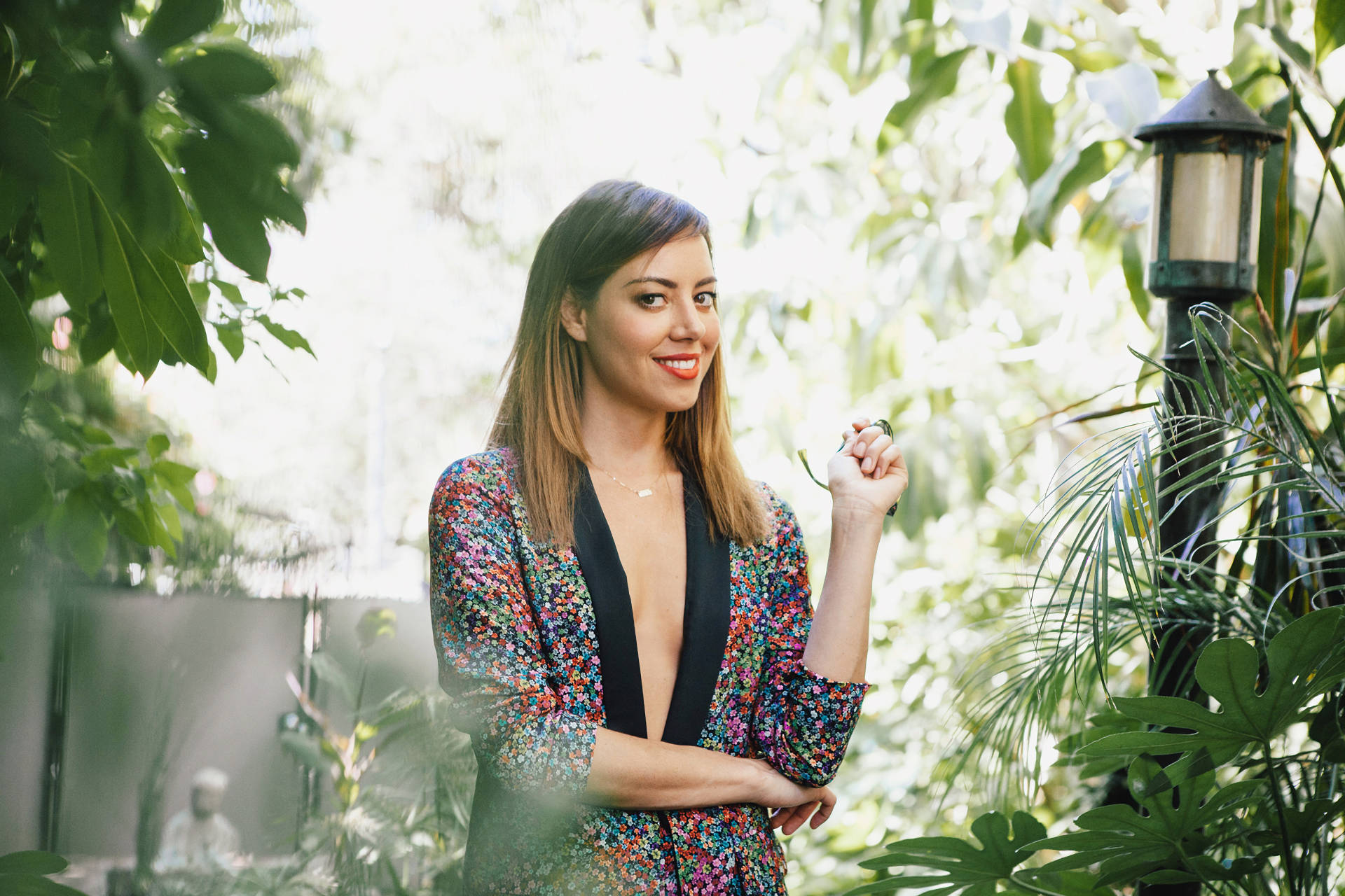 Aubrey Plaza, floral blazer, lush green foliage, Full HD Desktop Wallpaper