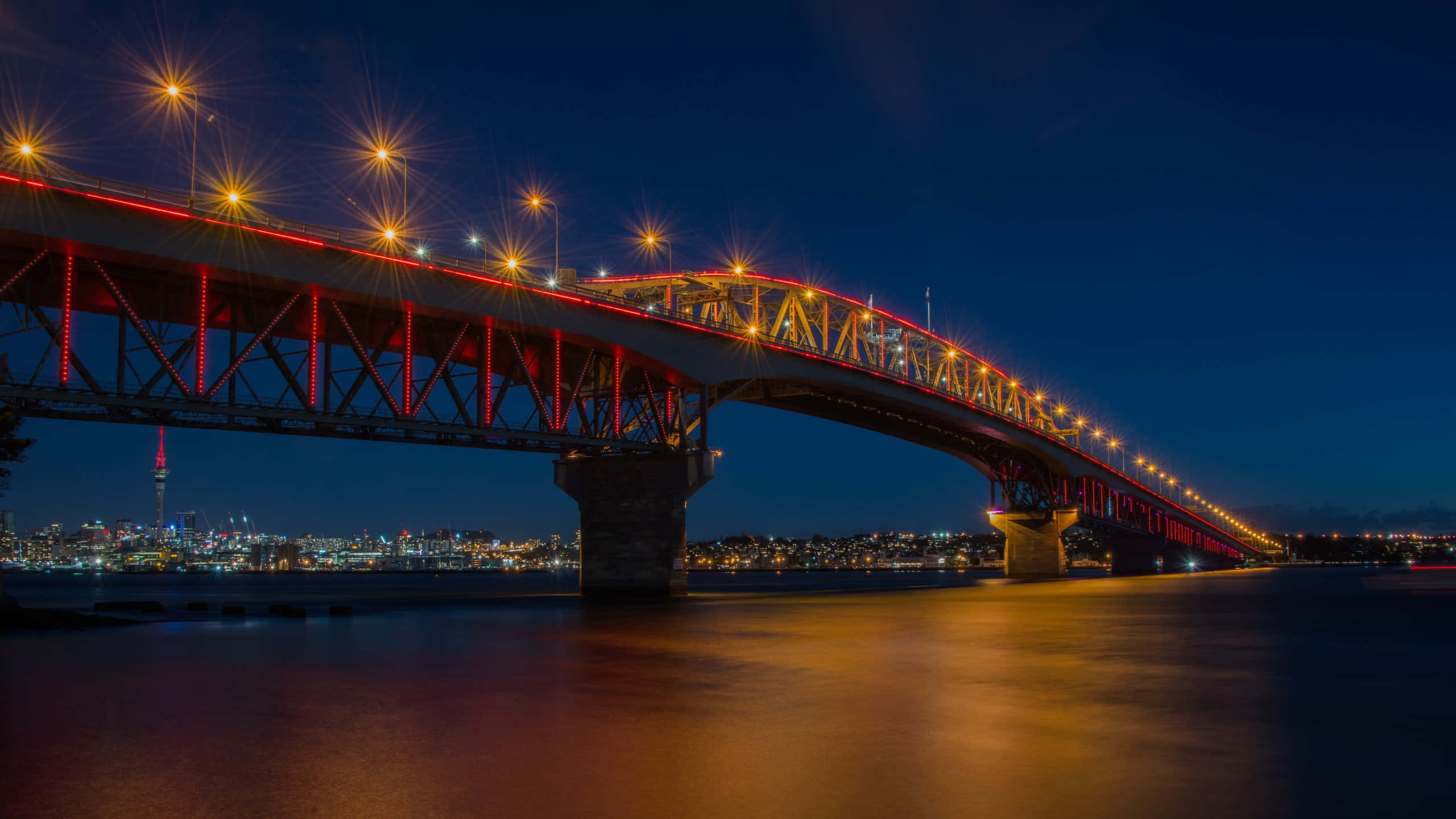 Auckland Harbour Bridge, night lights, glowing red bridge, 2K Desktop Wallpaper