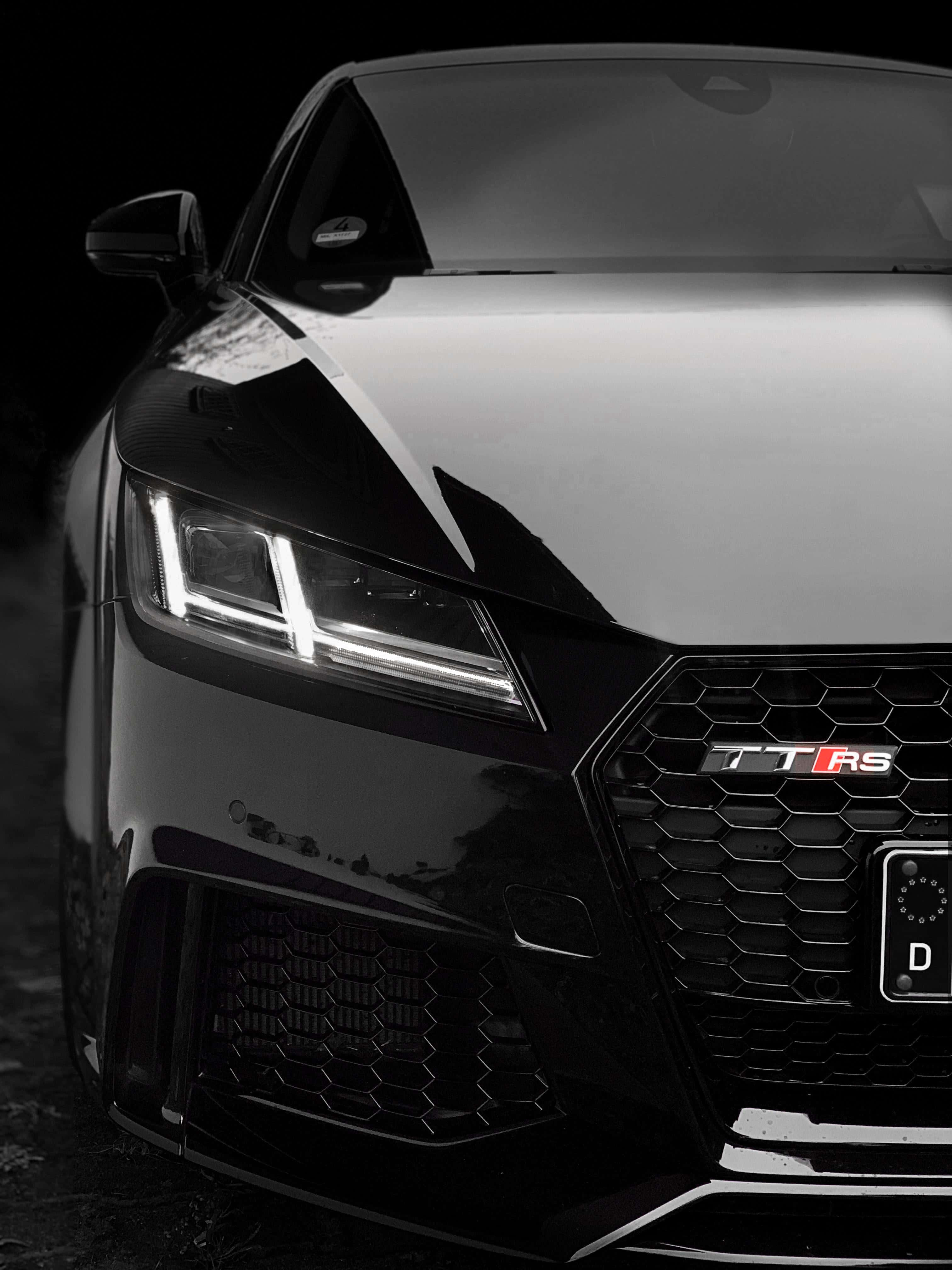 Audi TT RS, sleek black, glowing headlights, 4K Phone Wallpaper