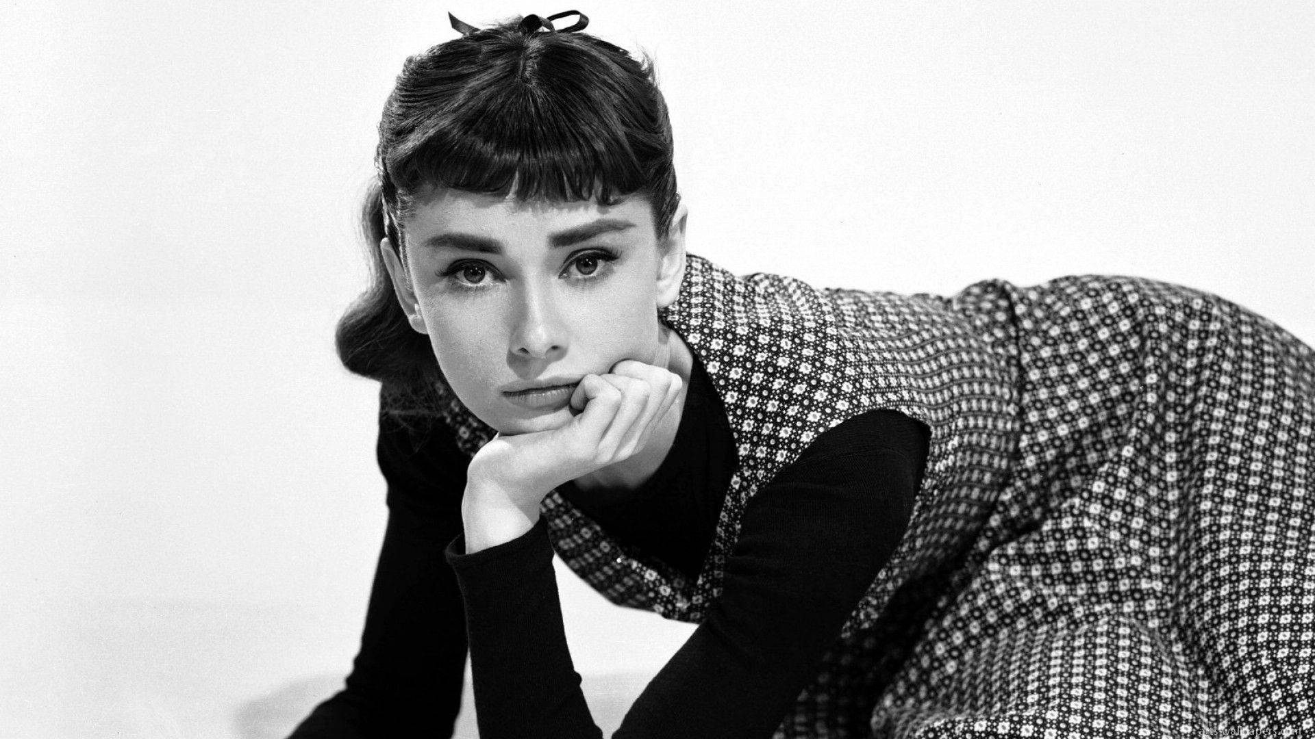 Audrey Hepburn, black and white studio portrait, chin resting on hand, Full HD Desktop Wallpaper