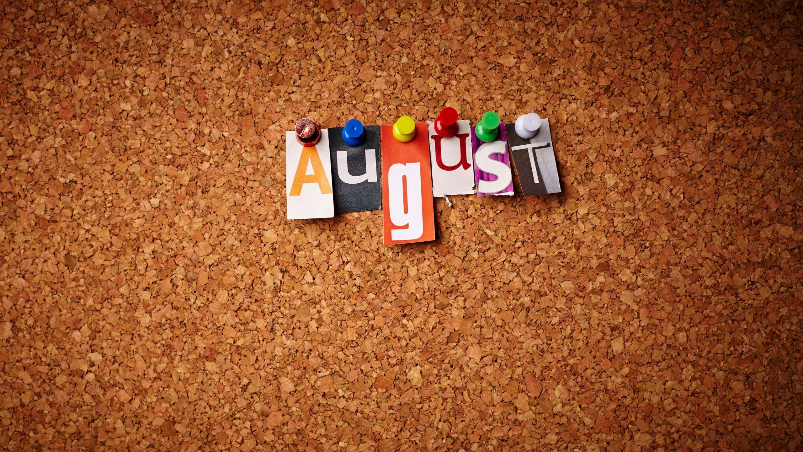 August, colorful letterpress type, textured corkboard background, 2K Desktop Wallpaper