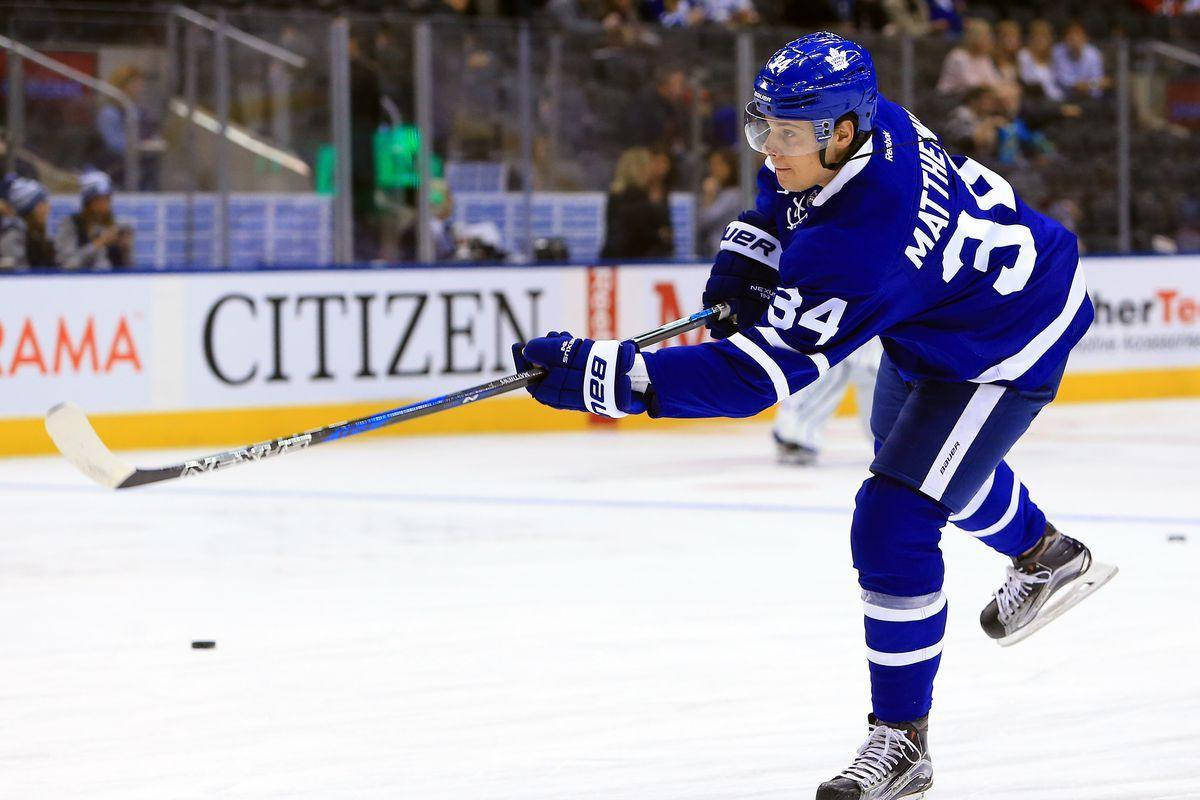 Auston Matthews, blue uniform, ice skating, SD Desktop Wallpaper