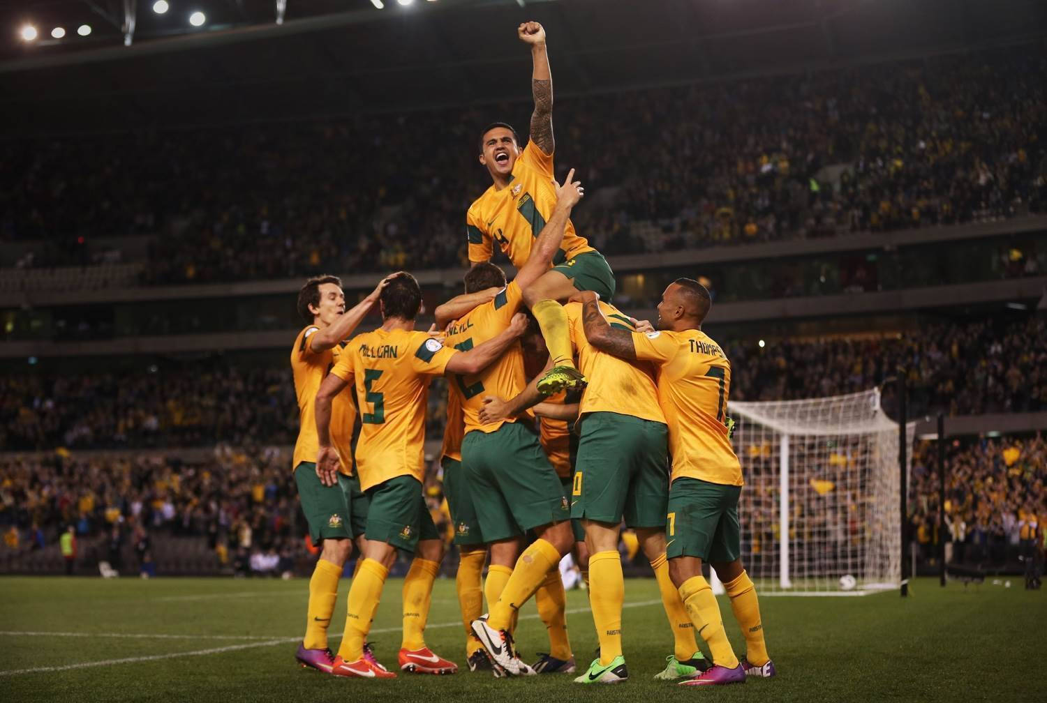 Australia National Football Team, yellow and green jerseys, celebrate a goal, HD Desktop Wallpaper