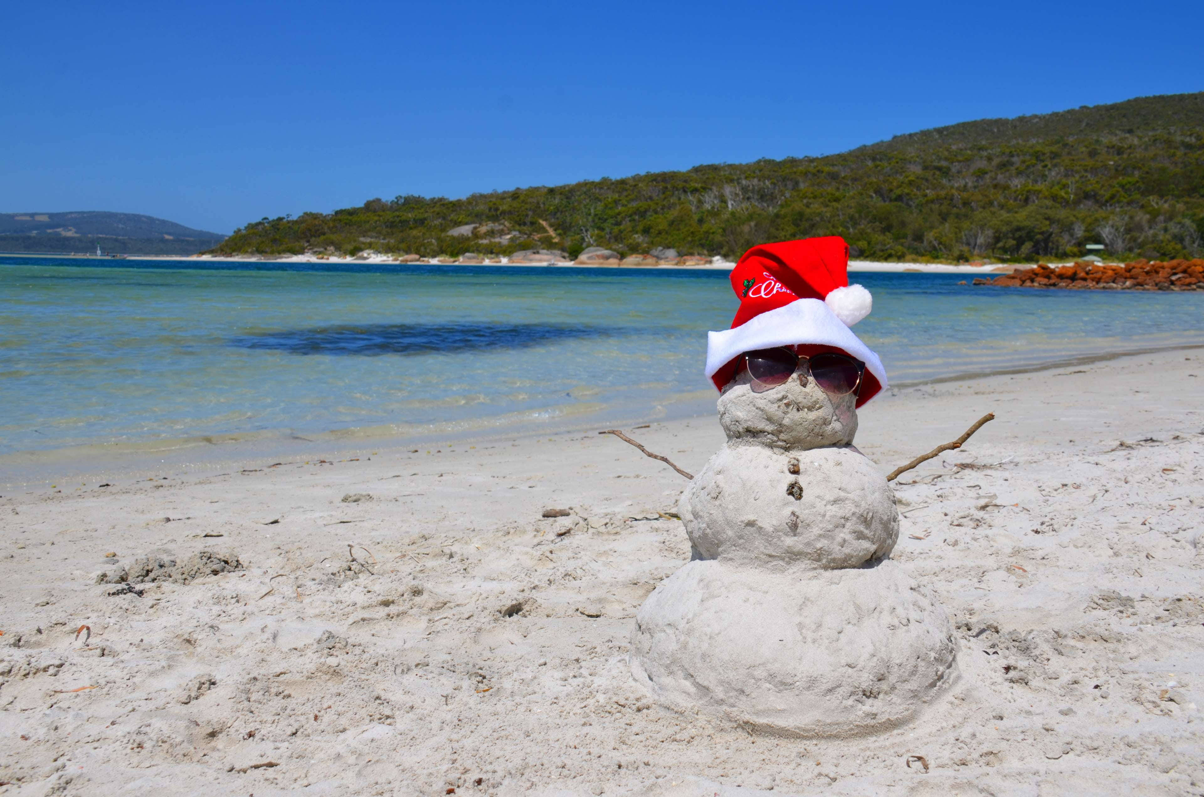 Australian Christmas, sand snowman, red Santa hat, 4K Desktop Wallpaper