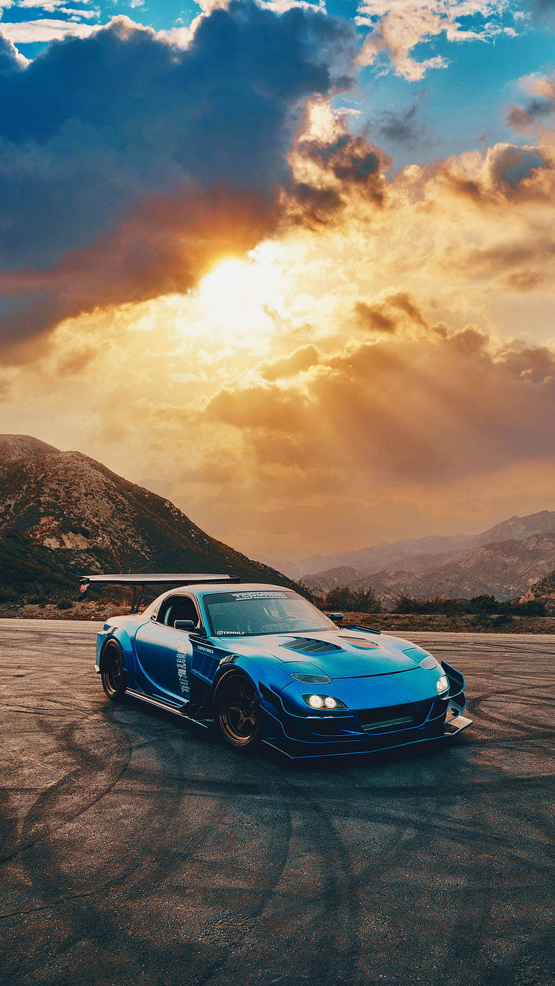 vibrant blue drift car, large rear wing, mountain road, HD Phone Wallpaper