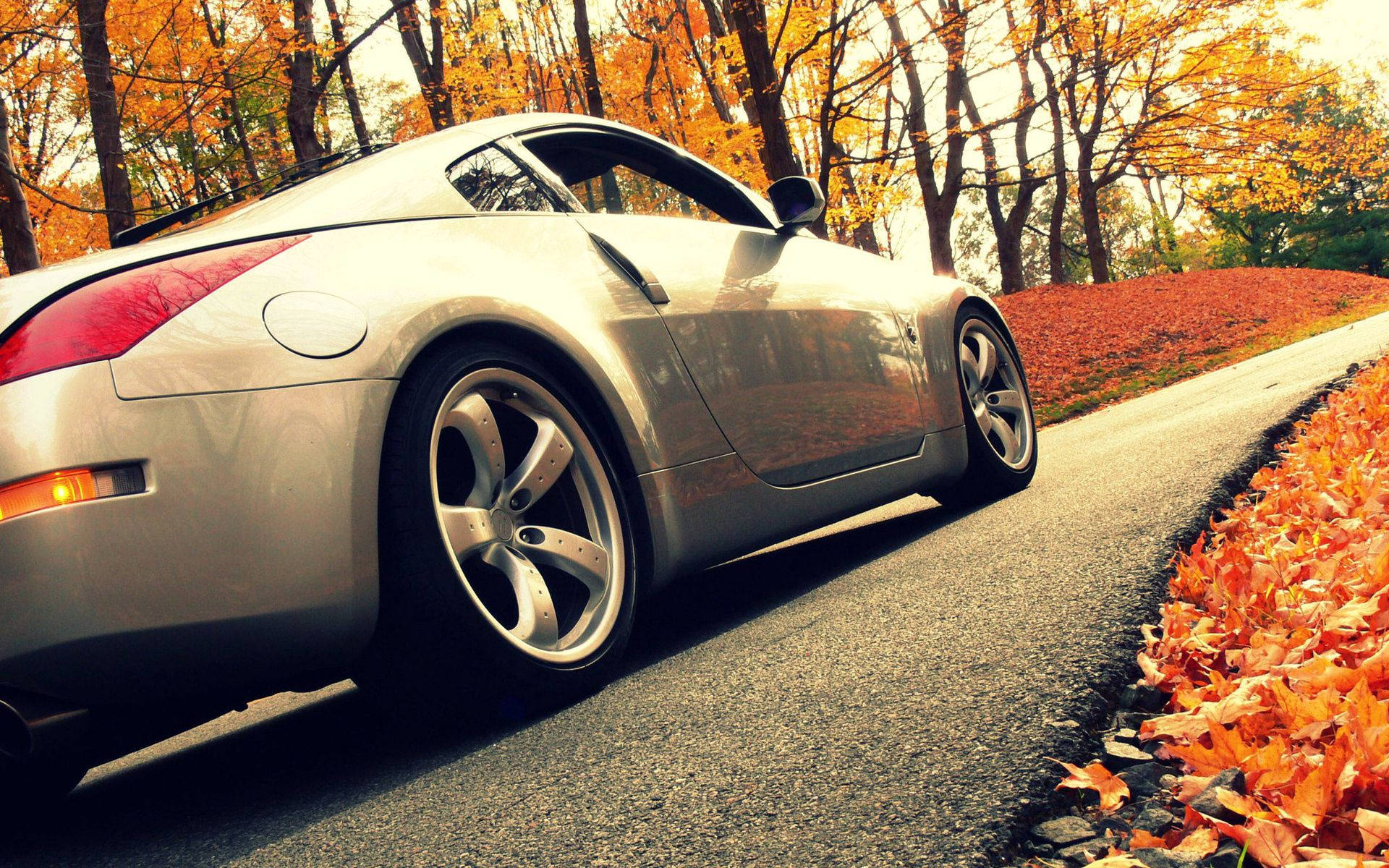 silver sports car, winding road, vibrant orange autumn leaves, Full HD Desktop Wallpaper