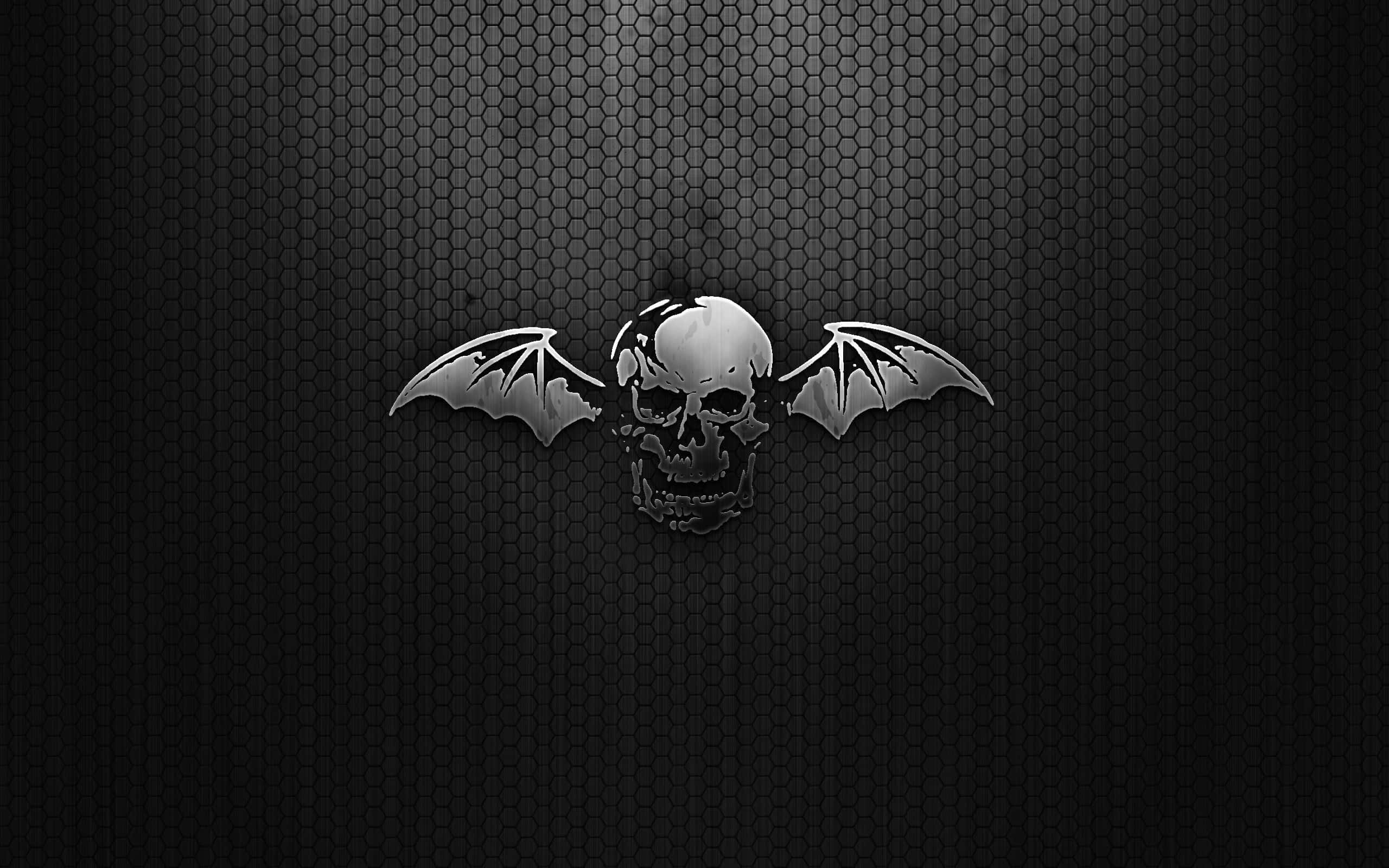 Avenged Sevenfold, metallic bat skull emblem, dark hexagonal mesh background, 2K Desktop Wallpaper