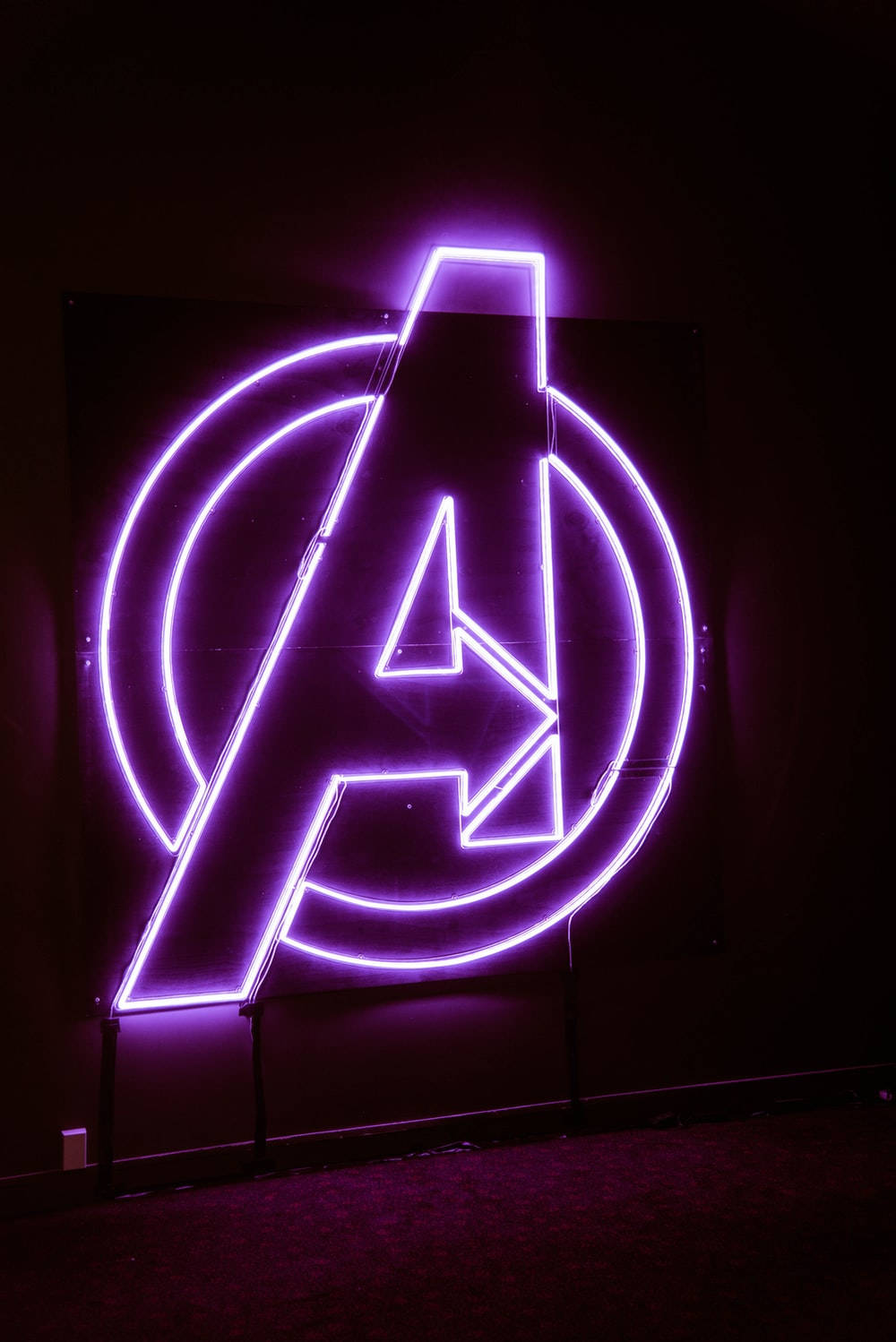 neon purple avengers logo, glowing purple neon, dark room, HD Phone Wallpaper