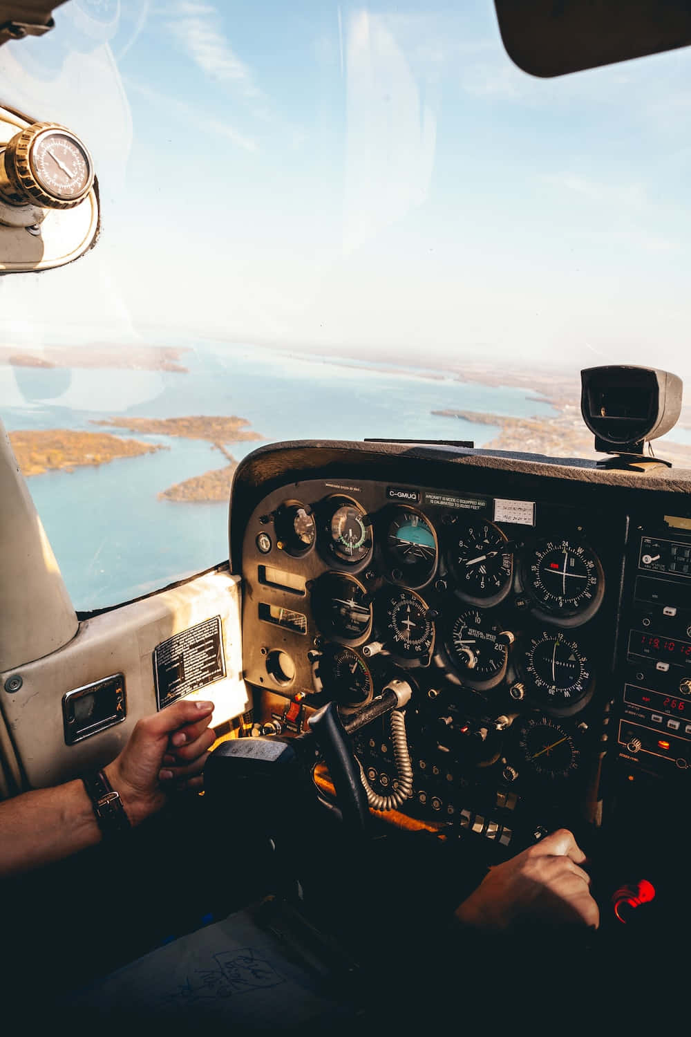 aircraft cockpit, pilot's hands, sunlit coastal landscape, HD Phone Wallpaper