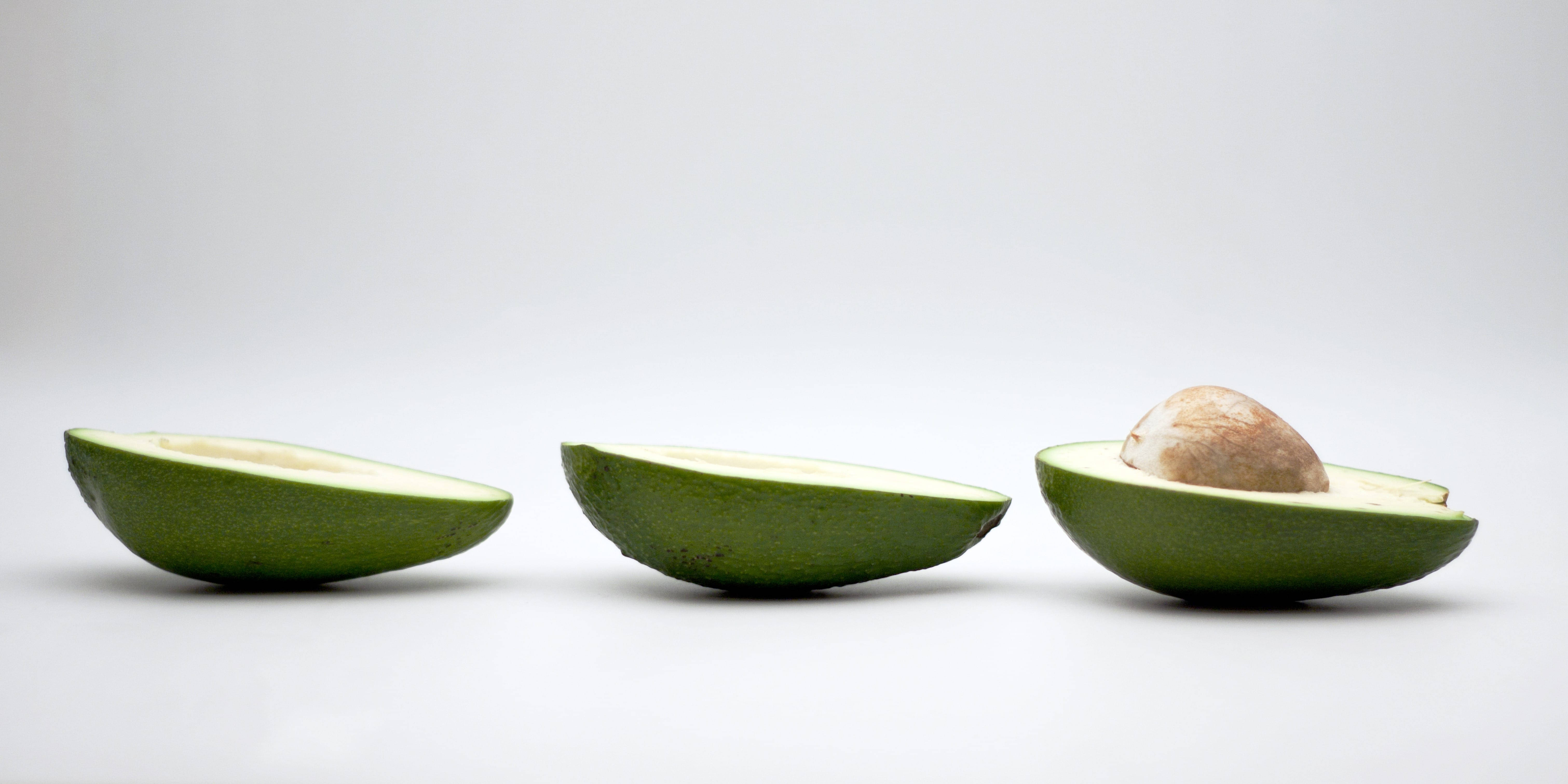 avocado fruit, avocado halves, pit intact, 5K Desktop Wallpaper