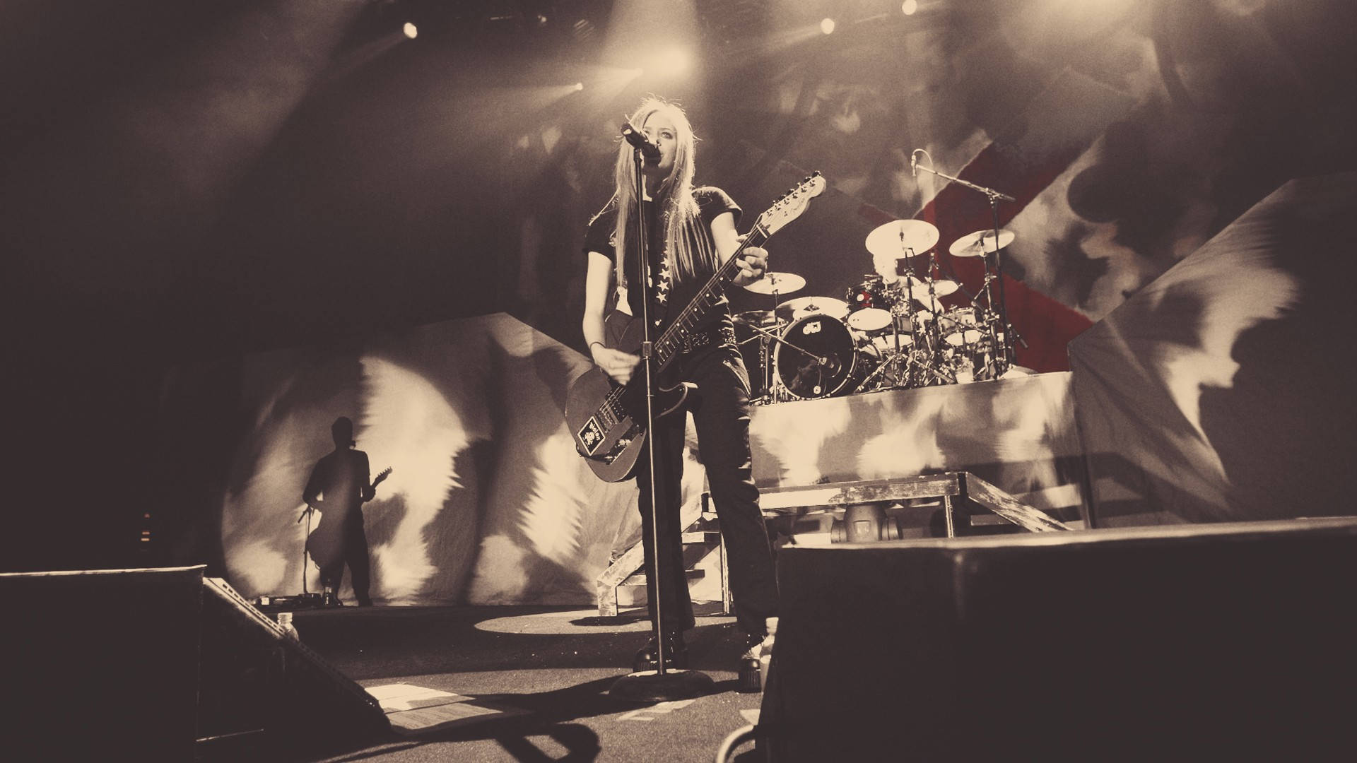 Avril Lavigne, electric guitar, dimly lit stage, Full HD Desktop Wallpaper