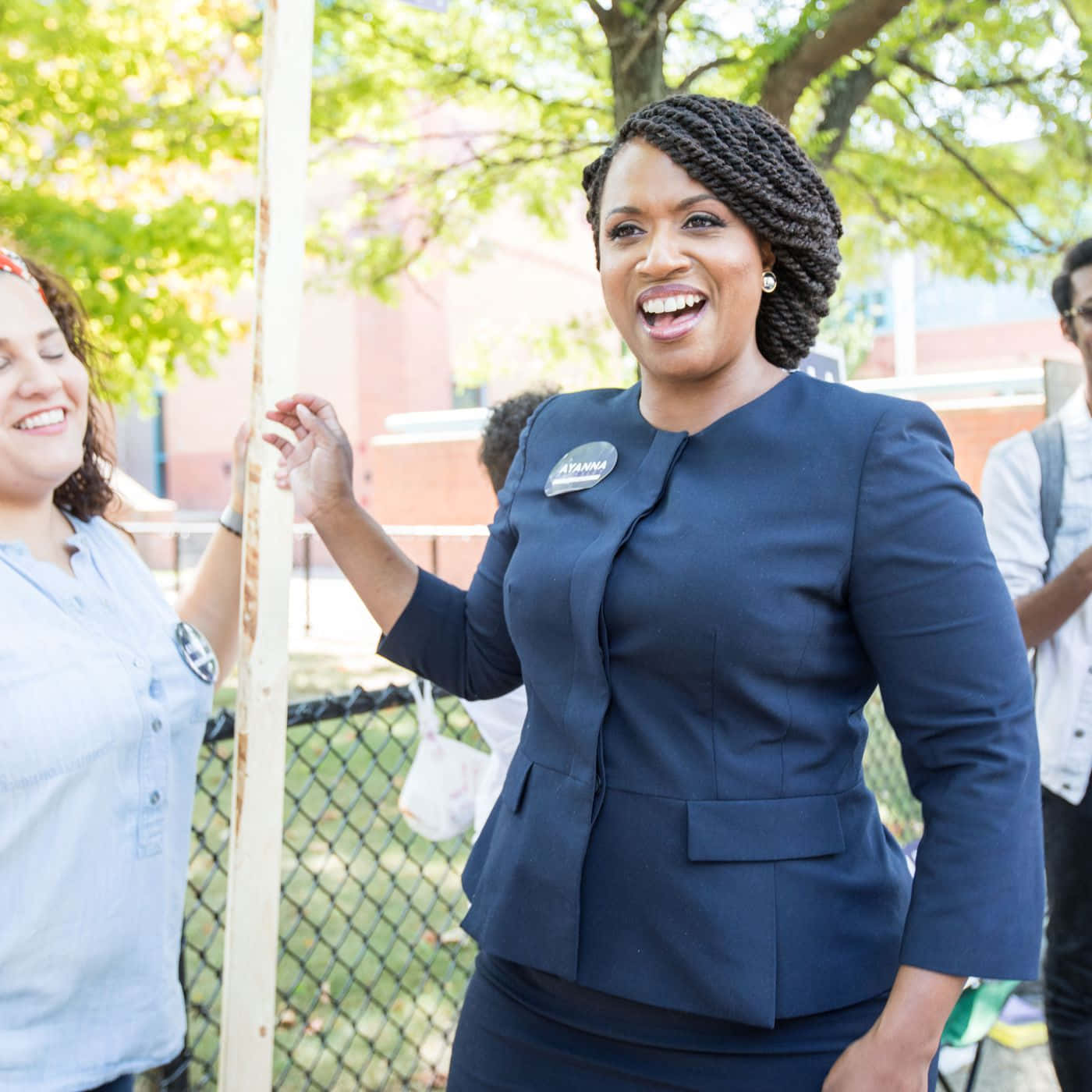 Ayanna Pressley, navy suit, bright green trees, HD Desktop Wallpaper