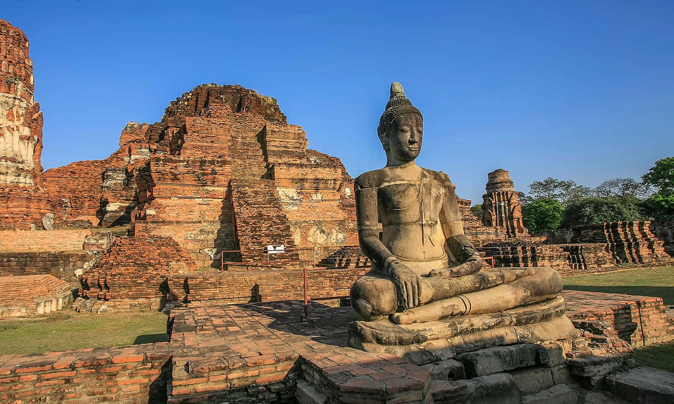 sacred Buddha statue, ancient weathered brick ruins, clear blue sky, HD Desktop Wallpaper