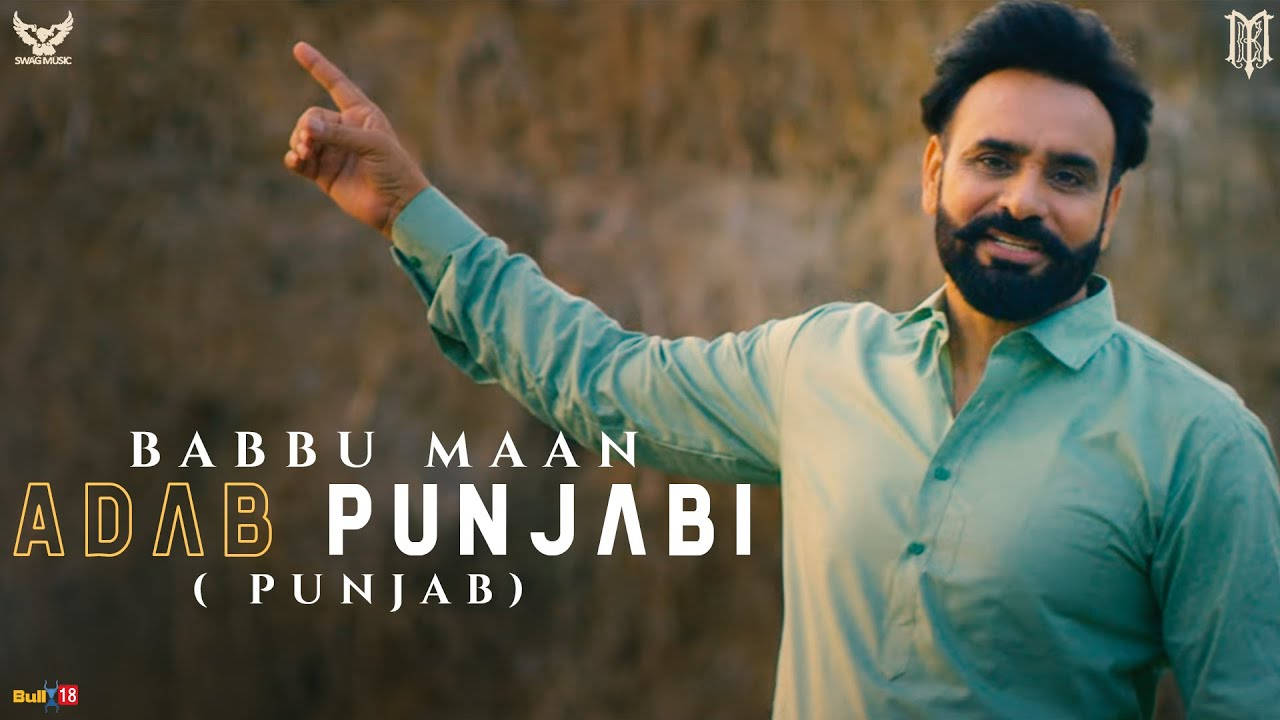 Babbu Maan, teal shirt, blurred rocky backdrop, HD Desktop Wallpaper