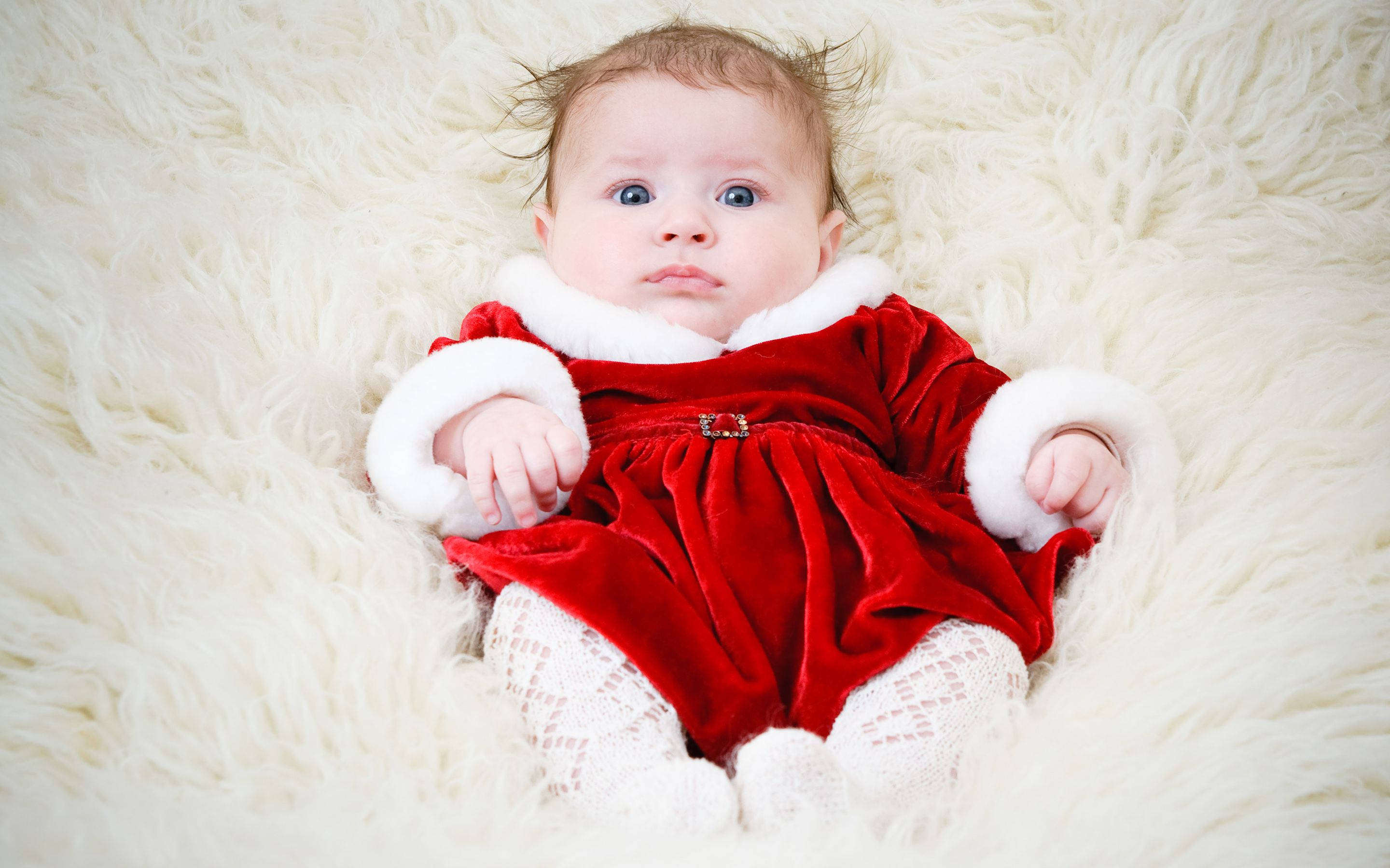 red velvet Santa outfit, white fur trim, fluffy white rug, 2K Desktop Wallpaper