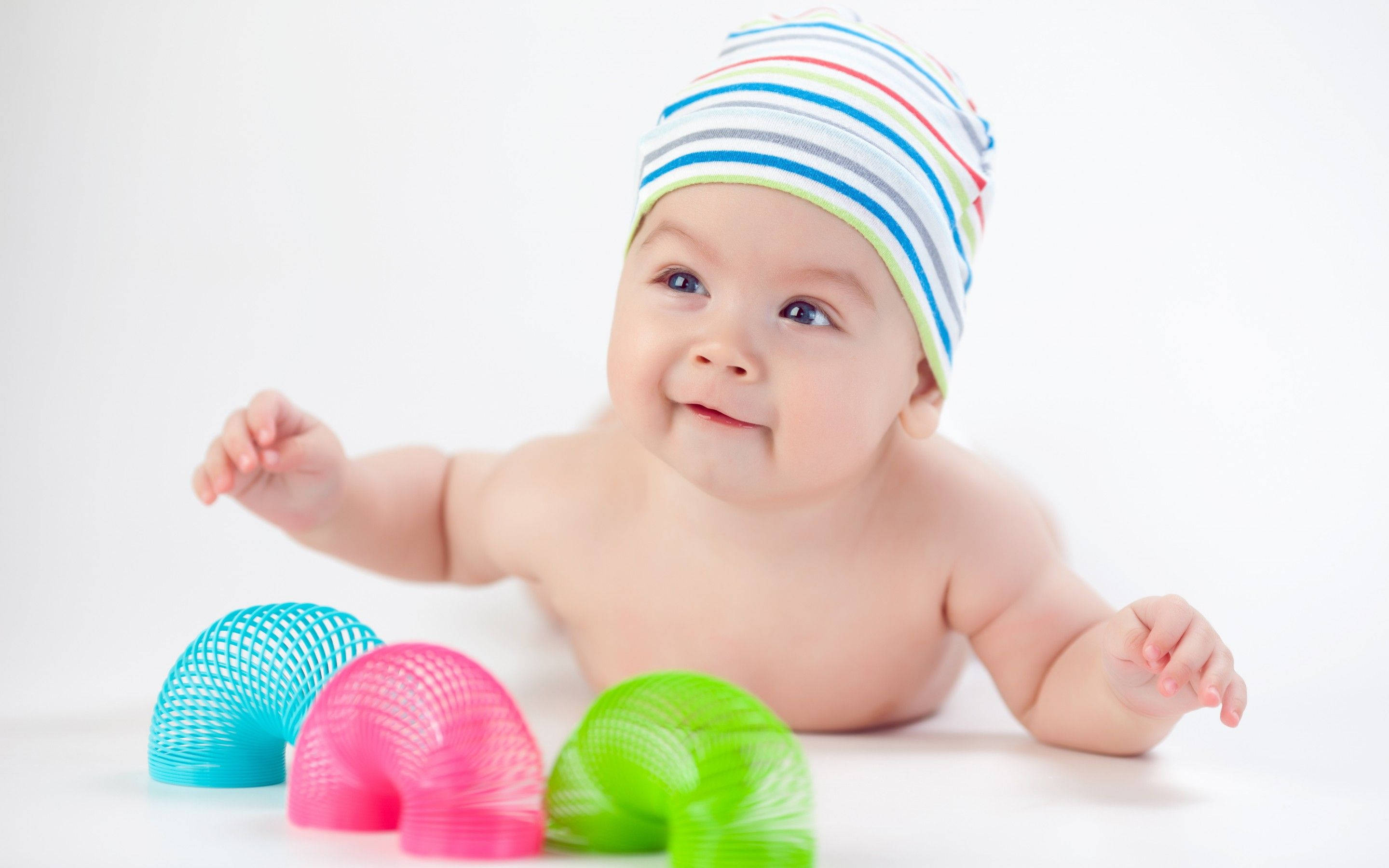 newborn baby boy, striped hat, white surface, 2K Desktop Wallpaper