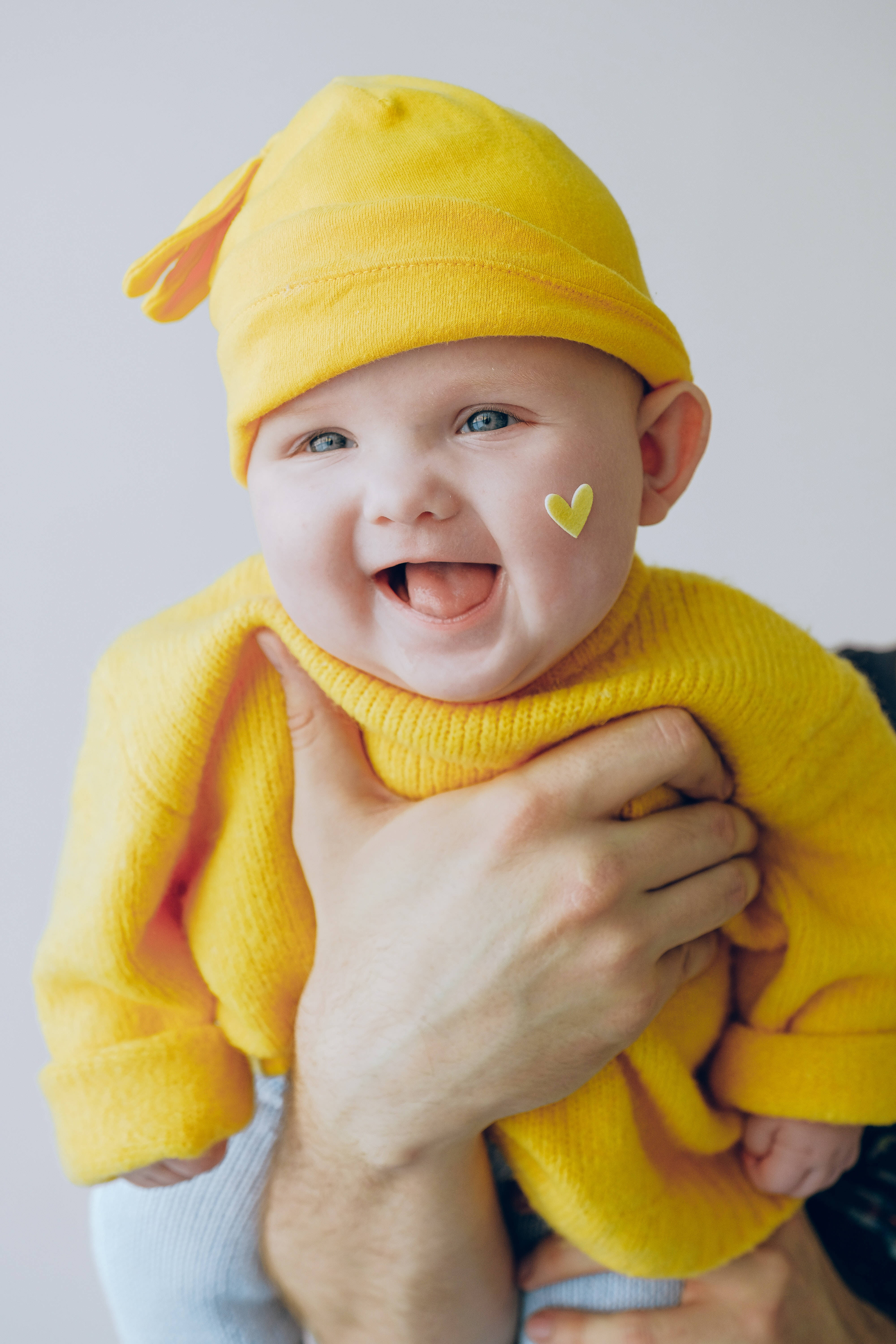 smiling baby, bright yellow outfit, yellow hat, 5K Phone Wallpaper