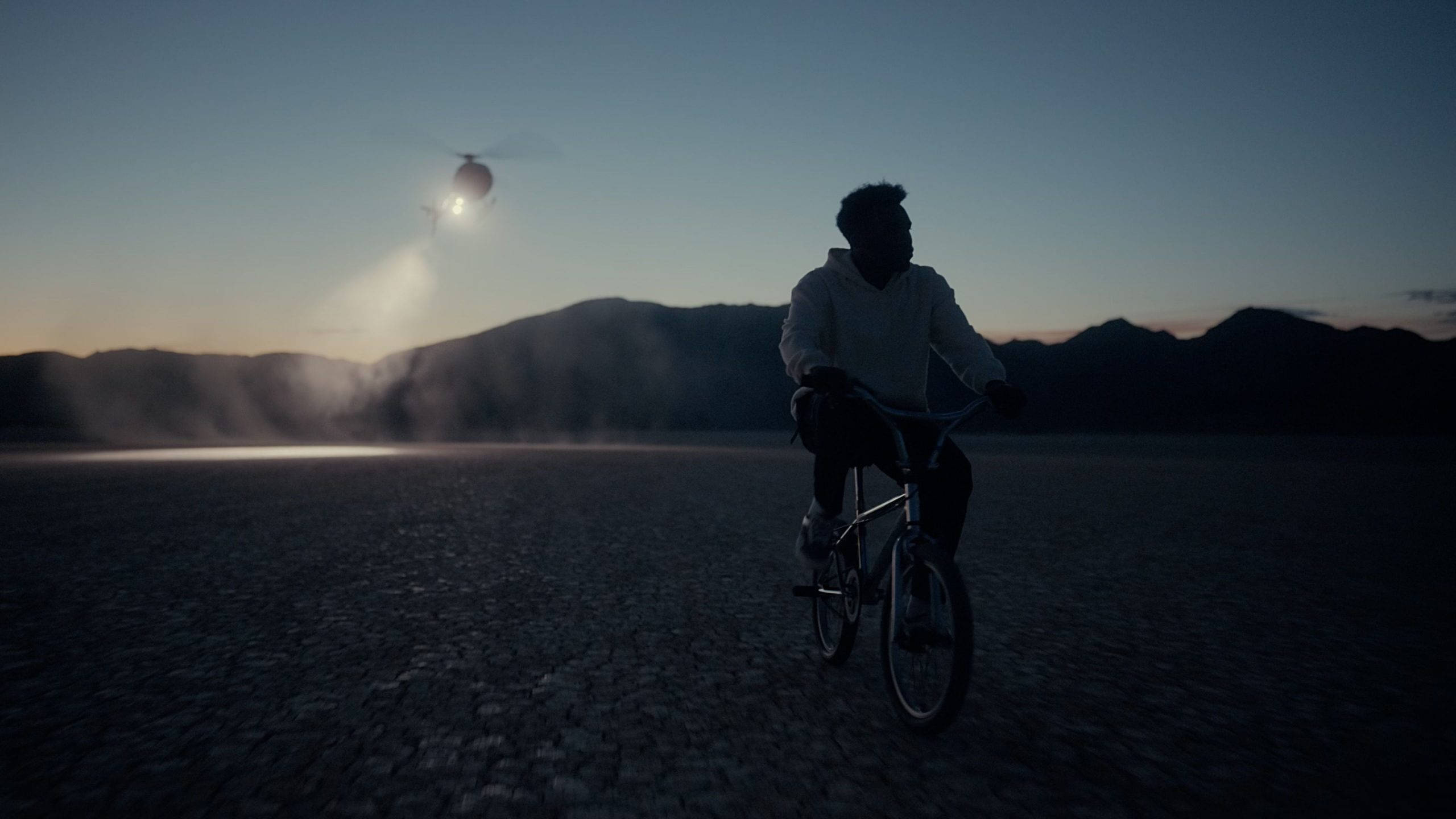 Baby Keem, BMX bike, cracked desert floor, 2K Desktop Wallpaper
