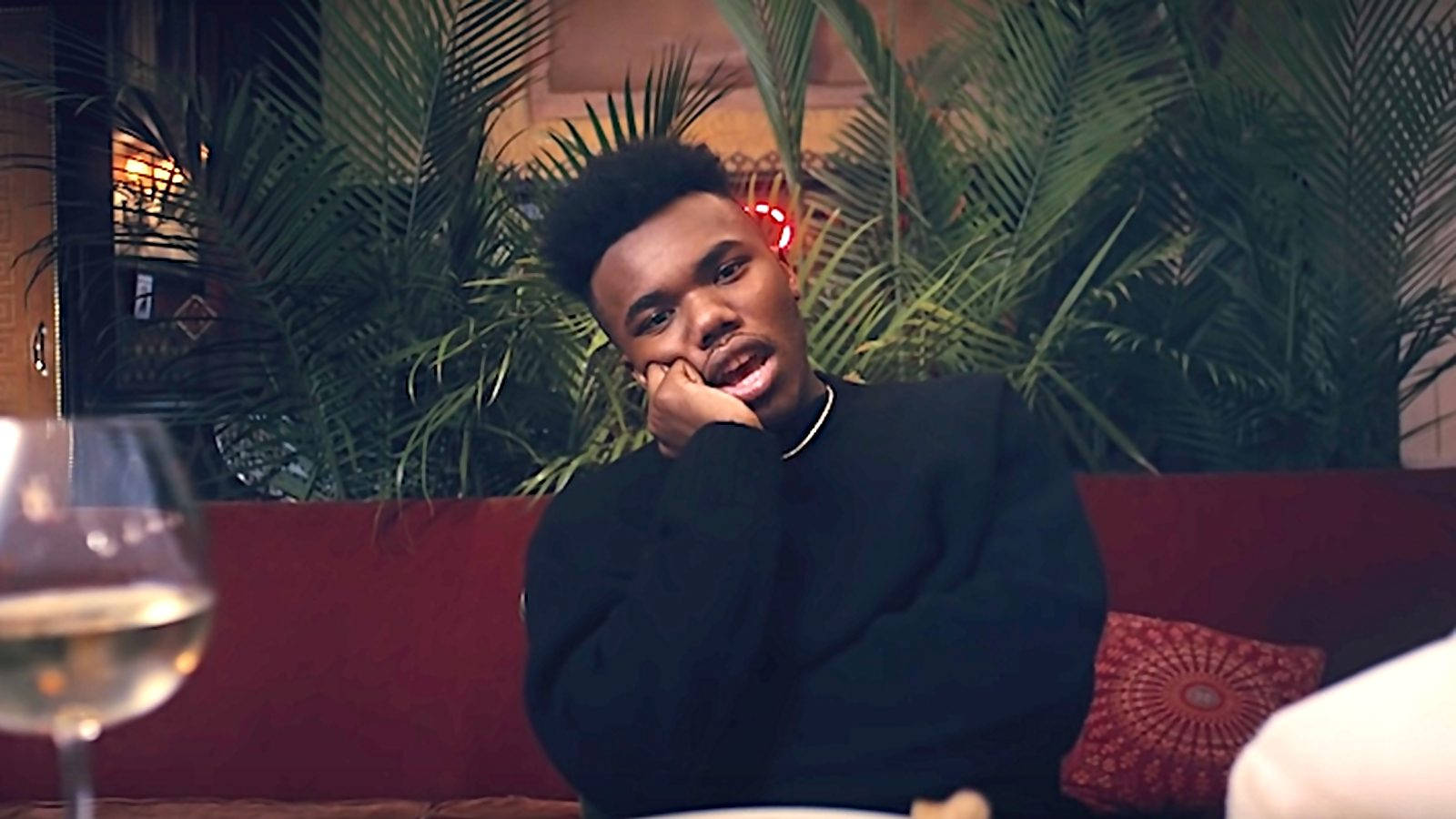 Baby Keem, red sofa, dimly lit lounge, HD Desktop Wallpaper