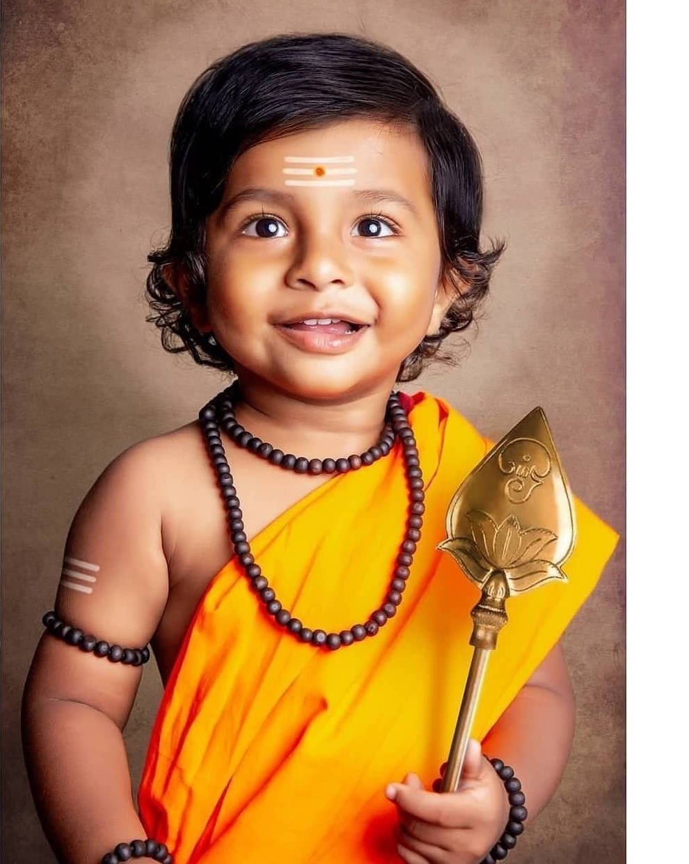 Baby Murugan, gold veera vel, orange robes, SD Phone Wallpaper